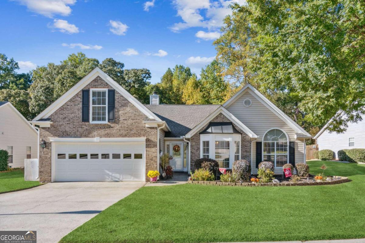 One level living at its finest! This large, spacious open ranch features hardwood floors throughout the main level, an updated kitchen with granite counter tops, and a huge Great Room with vaulted ceilings, fireplace and built in book shelves. The remodeled kitchen features a large island and opens to a beautiful eating area with plenty of room for family gatherings. The eating area opens to another sitting room off of the vaulted great room with beautiful views of the private landscaped backyard. The master bedroom is tucked away with a gorgeous remodeled bathroom and a connected sitting room with closet great for a nursery, office, or extra bedroom. Two more bedrooms and a large secondary bathroom round out the main floor. Upstairs you will find a large bonus room great for a playroom or extra living space! Step outside onto the covered back porch to a sanctuary! This amazing backyard has an awesome covered space plus a spacious, flat, fenced in private backyard great for pets or a kids play area! All of this located in a beautiful swim and tennis neighborhood minutes from shopping, dining, parks, and top rated schools!