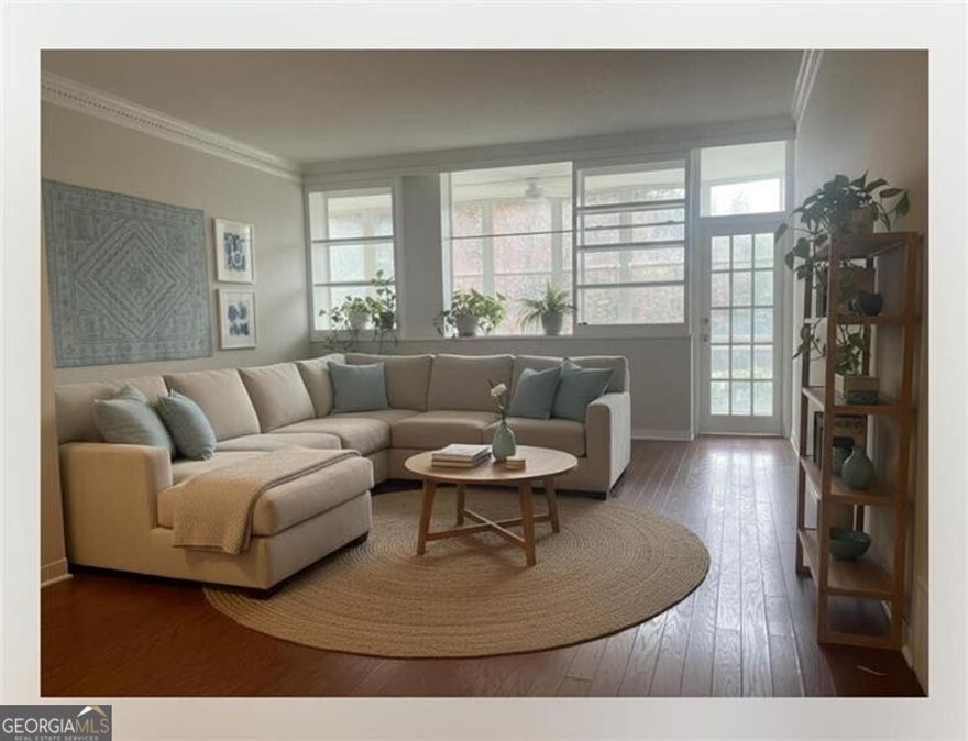 Rare opportunity for a fist floor end unit heart of Buckhead condo in a classic mid-century Heery and Heery building, boasting a spacious 30-foot open-air sunroom balcony perfect for relaxing or entertaining. Kitchen with stack washer & dryer, a primary bedroom with a double closets and balcony access, a secondary bedroom could also serve as a dedicated home office space, and a flat HOA fee covering unlimited utilities and all building maintenance. Residents benefit from a full suite of amenities, including a pool, 24/7 controlled access, and highly rated schools (7-9). This location offers effortless access to Buckhead Village Phipps Plaza & Lenox Square for premier shopping, dining, and entertainment-just a short stroll away! Hardwood floors flow throughout, complemented by wall-to-wall south facing windows that flood the space with natural light year-round. The layout seamlessly connects a sun-drenched family room and dinning area via wall-to-wall windows, while a hallway ensures privacy for the two spacious bedrooms. The unique bathroom layout allows for roommates to separately use the space without interruption.  Kitchen includes a stack washer-dryer. Step outside to one of the city's largest communal green spaces-over four acres of lush landscaped grounds with mature trees, ideal for summer barbecues and poolside social gatherings. For active lifestyles, nearby attractions include Frankie Allen Park, Chastain Park, Bobby Jones Golf Course, and the Atlanta Belt-Line, offering fields, tennis courts, pools, and golf. Explore the scenic Swan House and Gardens, savor upscale experiences in Buckhead Village, or shop conveniently at Whole Foods, Publix, or Trader Joe's, with charming coffee shops nearby. Enjoy condo living with abundant parking options, an oversized storage unit.