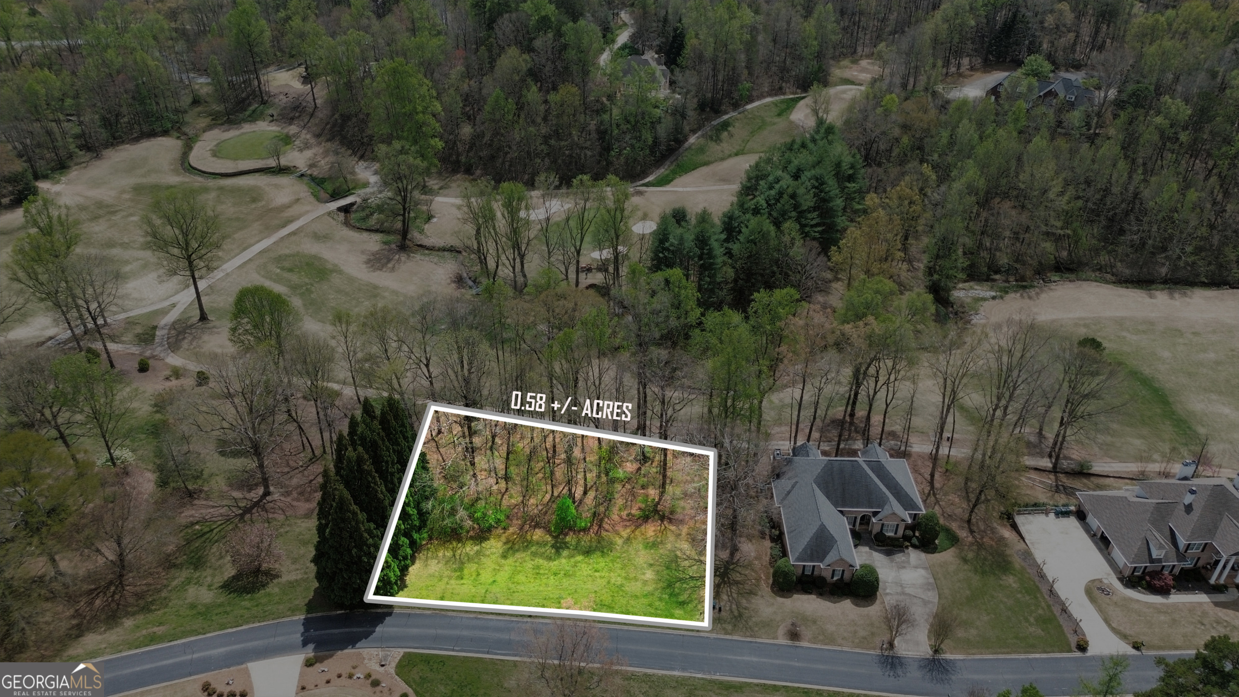 INCREDIBLE BUILDING OPPORTUNITY IN PREMIER NORTHEAST GEORGIA GOLF COMMUNITY, THE ORCHARD... Over 1/2 acre of usable level land suitable for building your dream home. This lot is unlevel, offering potential for basement lot development. With cleared lot you will have views of the 10th tee box, 11th green, and 12 fairway! Live and play with the extensive member amenities of The Orchard Golf and Country Club including private 18-hole golf course, driving range, club house, and pool. Community boasts stunning mountain views, lakes, apple orchards, and wild life galore! Lot is in an excellent location within the community yet tucked away affording plenty of privacy. Conveniently located near downtown Clarkesville for all your shopping, dining, and entertainment needs plus minutes from Highway 365 - perfect for commuters! Bring your plans and ideas to make this special property your own! Call our team for your private showing!