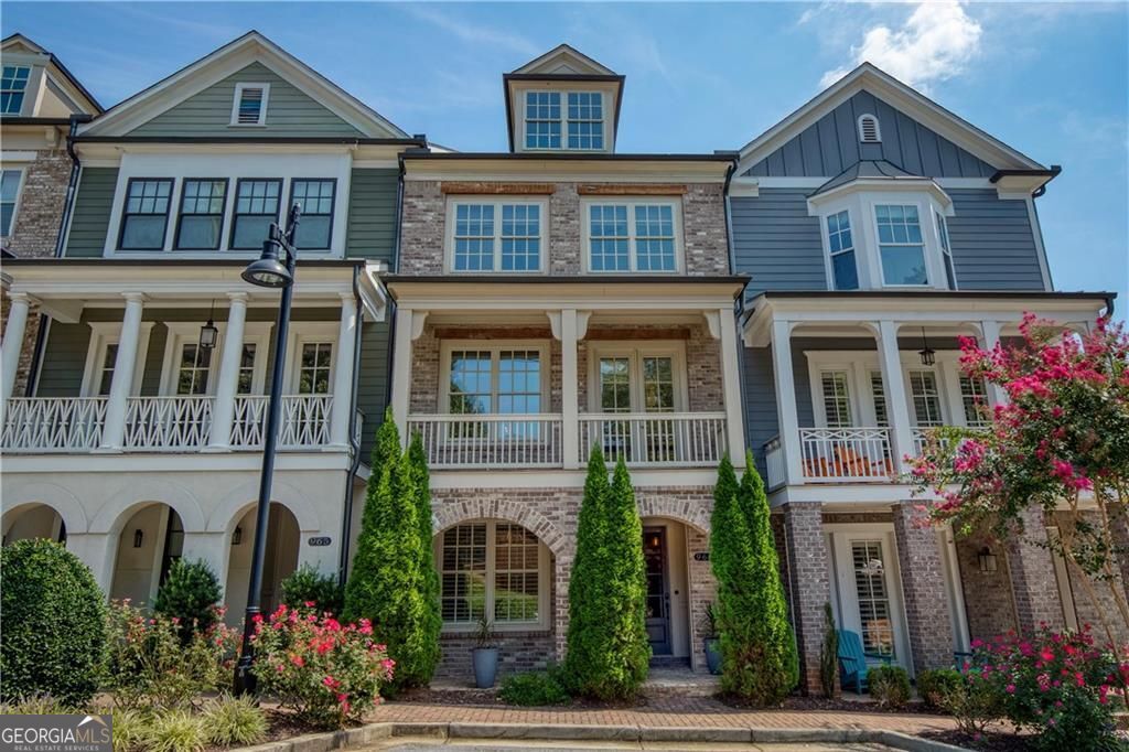 Welcome to timeless sophistication just steps from the vibrant heart of Historic Roswell. No rideshare needed for this location, location, location! Built in 2018 by the renowned John Weiland Collection, this light-filled 3-bedroom, 3.5-bathroom townhome blends classic charm with modern luxury. Step inside to discover soaring ceilings, rich French oak hardwood floors, and insulated windows that frame every room with warmth and natural light. The chef's kitchen is a culinary dream-featuring a gas cooktop, double ovens, a walk-in pantry, and seamless flow into the keeping room, breakfast nook, and formal dining area for effortless entertaining. Retreat to the light-filled owner's suite, a true sanctuary of comfort and style. Thoughtfully designed with a spacious layout, dual walk-in closets, and refined finishes, this private haven features a serene bath ideal for unwinding. Whether you're enjoying the walk-in shower or simply relaxing in the peaceful ambiance, every detail invites tranquility and escape. Enjoy the flexibility of multiple living spaces, plus a dedicated elevator shaft/closet for future accessibility. Both front and rear porches invite morning coffee or evening gatherings, while the quality craftsmanship throughout ensures lasting comfort and style. Wired for high-speed internet and AT&T Fiber ready, this home supports modern living with ease. Easy access to Georgia 400 and located just moments from Roswell's beloved shops, restaurants, parks, and cultural landmarks-this home offers the perfect blend of walkability, elegance, and thoughtful design.