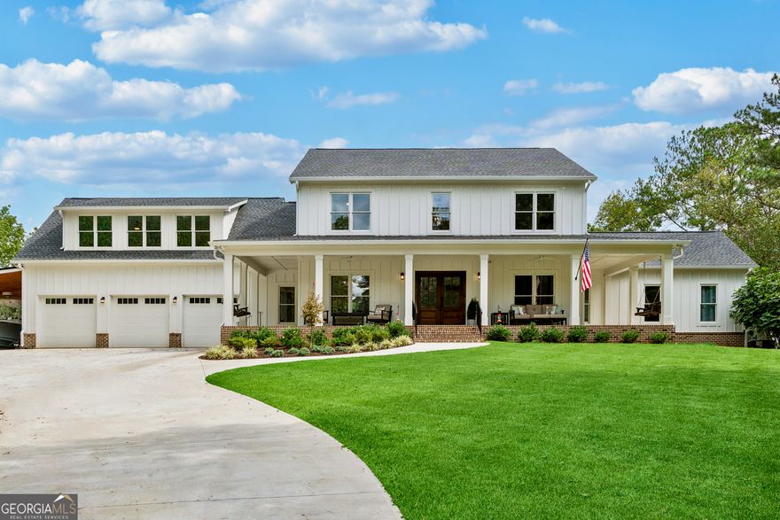 Welcome to a home where space, charm, and modern living come together in perfect harmony.  This stunning farmhouse is more than just a house-it's a retreat designed for gathering, growing, and creating lasting memories. With five spacious bedrooms and four and a half baths, there's room for everyone to enjoy their own space, while still offering plenty of places to come together.    From the moment you step inside, the open floor plan invites you in. A light-filled living area flows seamlessly into a dining space perfect for family dinners and celebrations. At the heart of the home, the chef's kitchen is ready for everything from morning coffee to holiday feasts. A bonus room offers flexibility for movie nights, hobbies, or play, and a private office makes working from home a breeze. Downstairs, the finished basement provides even more space, complete with an additional garage bay-ideal for extra storage, a workshop, or both. This is also the home of your 26Kw Generac Guardian whole home generator with two transfer switches. 400 amp total service backup. Have something else in mind for your new basement? No worries, there is also a massive unfinished room in the basement waiting on your vision.     Step outside to find a setting that's nothing short of a dream. An oversized deck offers sweeping views of the 21-acre property, while a screened-in back porch-accessible from both the living room and the master suite-provides the perfect spot to unwind. The rolling landscape offers privacy, fresh air, and the freedom to garden, explore, or simply relax in the peaceful countryside.    Whether you're hosting summer barbecues, watching the kids run under a wide-open sky, or enjoying quiet evenings under the stars, this home makes it all possible.    This isn't just a place to live. It's a place to put down roots and thrive.