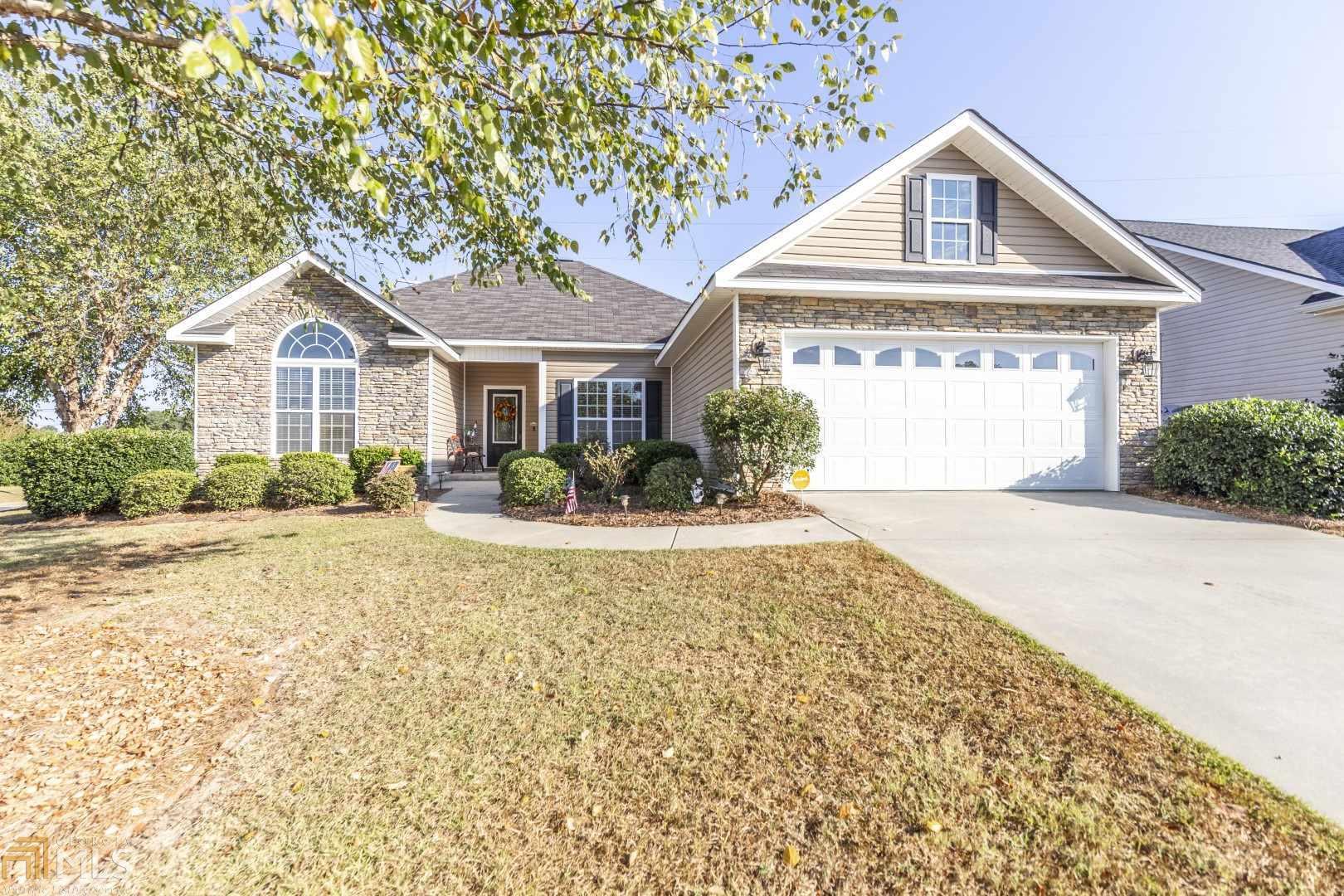 QUALIFIES FOR 100% USDA FINANCING. This home sits on a corner lot and in close proximity to shopping, entertainment, restaurants, public schools, quick access to the interstate and more. It features 3 BRs, 2 full baths, formal dining and eat in kitchen areas. Unlike others, it includes a 2 car garage with a rear garage door for moving large vehicles in and out of the backyard. The garage attic consists of solid flooring for storage. Enjoy sitting in the cozy screened in back porch or outdoor gazebo.