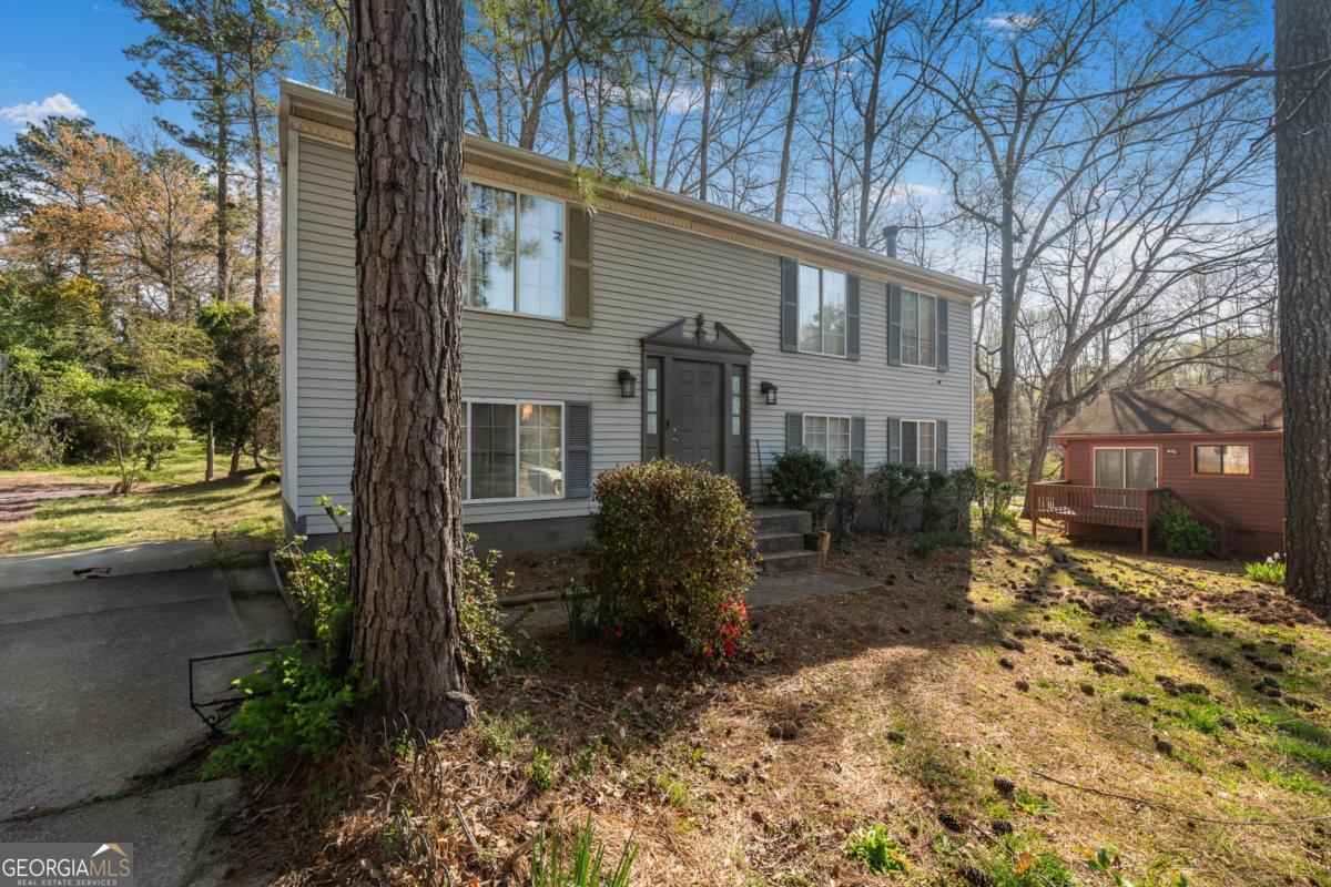 Beautiful Move-In Ready Split-Level Home in Lithonia! Welcome to 3274 Adelade Ct, Lithonia, GA 30038-a stunning 4-bedroom, 3.5-bathroom split-level home with a full finished basement, situated in a quiet roundabout for added privacy and minimal traffic. This spacious residence features an open-concept layout, perfect for modern living and entertaining. Enjoy peace of mind with a fairly new HVAC, roof, and updated kitchen flooring. The home is completely move-in ready, offering both comfort and style. The finished basement provides additional living space, ideal for a guest suite, home office, or recreation area. Located in a desirable neighborhood, this home is a must-see! Don't miss out-schedule your showing today!