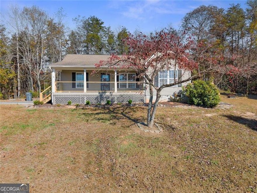 Welcome to 39 East Point Drive, a beautifully maintained and renovated home nestled in the heart  of North Georgia.  This property offers the perfect blend of comfort, privacy, and convenience, just minutes from historic downtown, award-winning wineries, hiking trails, and the University of North Georgia. Convenient to Dawsonville, Dahlonega and Gainesville.  Minutes from Highway 400!  Step inside to a recently renovated home. The kitchen offers ample cabinet space, and a spacious layout ideal for everyday living or hosting guests. The primary suite provides a peaceful retreat wirh completely updated bath, while additional bedrooms offer flexibility for guests, a home office, or a growing family.  Outside, enjoy a private backyard perfect for relaxing, gardening, or entertaining. A roomy porch extends your living space outdoors-ideal for morning coffee, quiet evenings, or gatherings with friends. The property sits on a well-kept lot in a quiet neighborhood, with mature trees and a serene  setting.