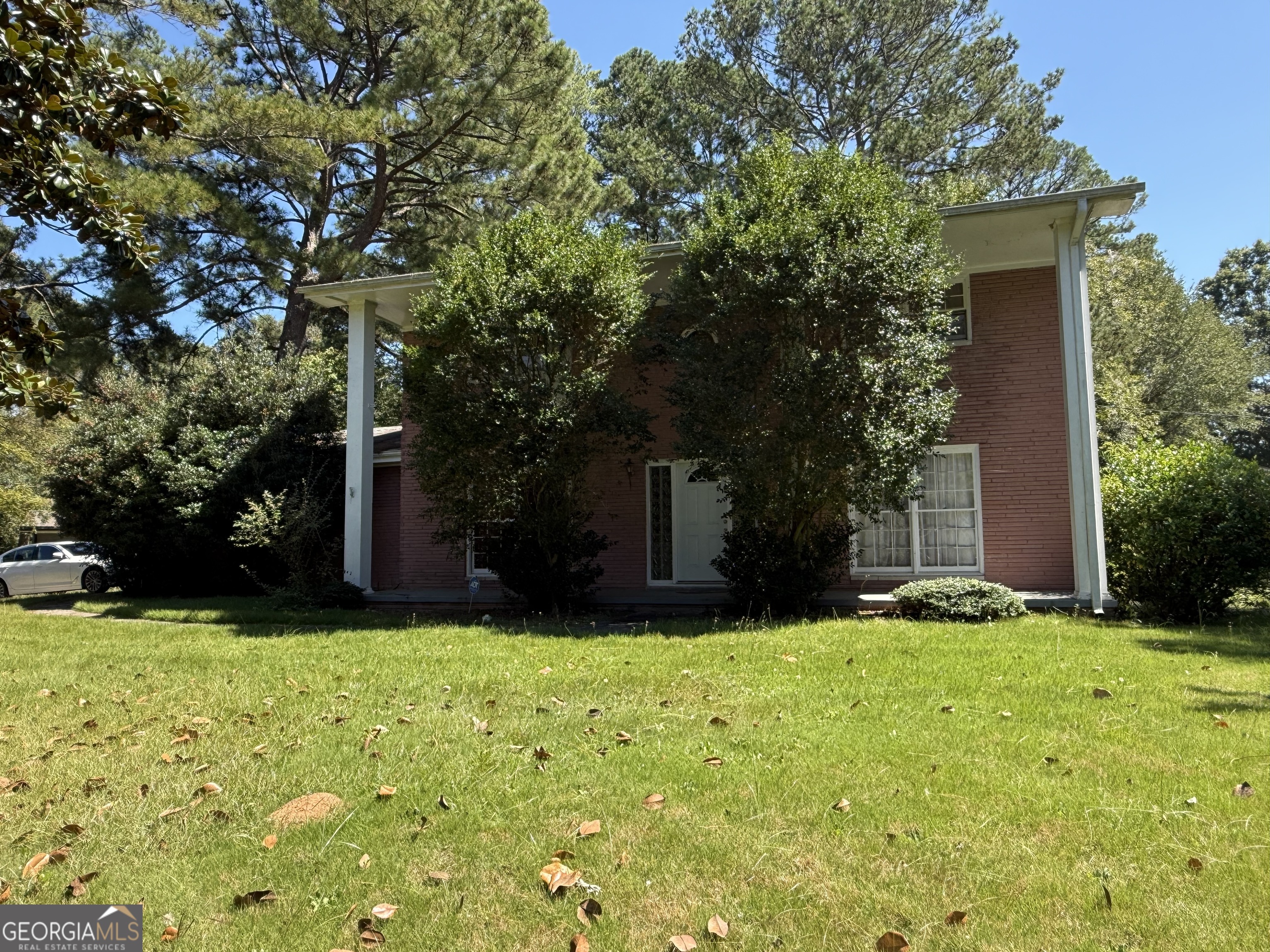 INVESTOR SPECIAL - CALL FOR DETAILS,guest room on main level, 4 spacious bedrooms up. Hardwood flooring, living and dining rooms, carport and opens to a private backyard with inground pool (not used in several years). 4 sides brick, located in the center of convenience. Old Town Conyers, Rockdale hospital, parks and restaurants/entertainment.