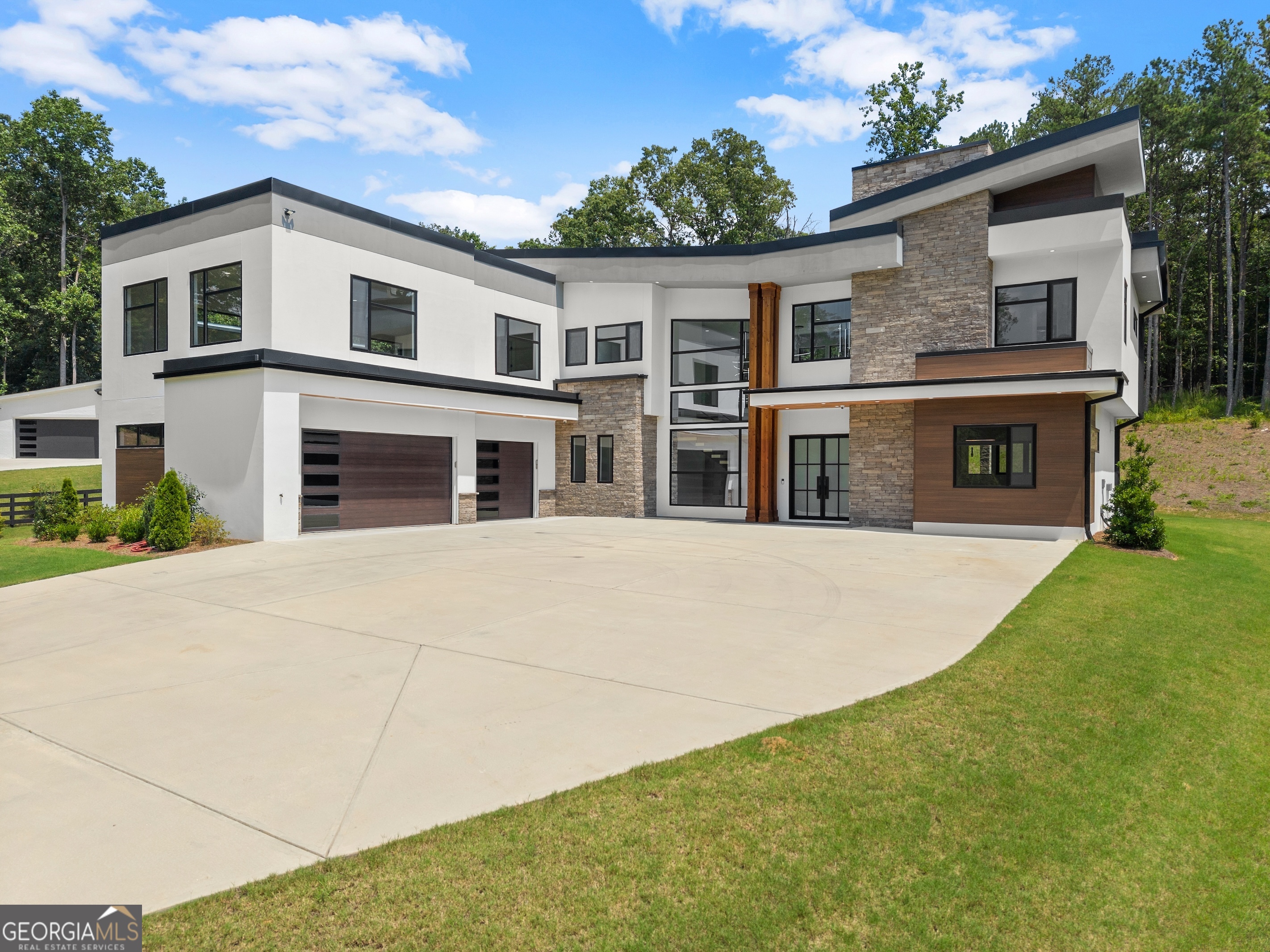 A Beautiful Balance of Comfort, Style, and Location. Tucked into one of Gwinnett's most vibrant and convenient areas, this refined residence invites you to slow down and savor the good life. Just moments from the Mall of Georgia, Chateau Elan, Gwinnett Exchange, and with easy access to I-85, I-985, and HWY 124, everything you need - from weekend escapes to daily errands - is right around the corner. This home welcomes you with an atmosphere that's both graceful and grounded. Soaring ceilings, elegant details, and light-filled rooms create a peaceful retreat from the everyday. Whether you're preparing a cozy meal at home or entertaining guests, every space flows with intention and warmth. Designed for both beauty and livability, this home offers a lifestyle filled with ease, connection, and quiet luxury. Listing Agent related to Seller.