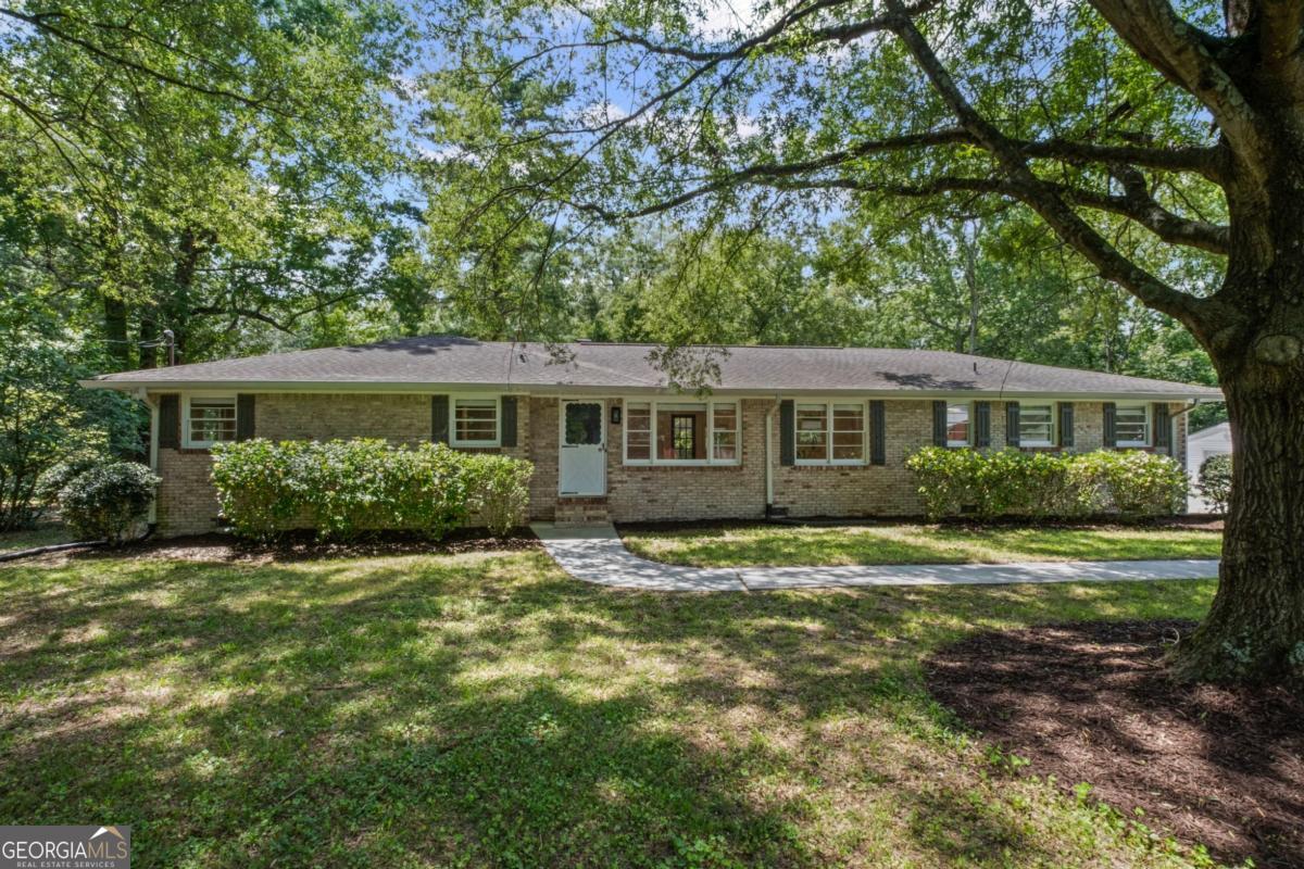 Yes, you can HAVE IT ALL! You absolutely must come see this fully renovated homestead on 2.6 ACRES!!! Get the land and space you want PLUS the house of your dreams! Fresh updates include ALL NEW: open floorplan, hardwoods throughout, quartz countertops, marble backsplash, sink, paint, electrical panel, water heater and MORE! Make use of the large BONUS ROOM for a home office or playroom. Light a fire in the wood burning stove on cold nights. And spend evenings relaxing in the florida room overlooking your acreage and farm. Use the detached garage and carports for storage or whatever projects you take on. Flat yard and farmland have been cleared and prepped for any use you can dream up. Property includes a spring, creek, garden, fruit trees, blueberry bushes, chicken coup, TWO bridges and more! Don't miss this one. Properties like this one don't come along often...