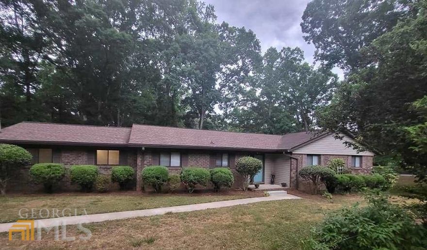 5 bedroom - 3 Bedrooms on main, 2 bedrooms in basement ranch home in peaceful neighborhood. Just minutes to shopping, dining,UGA, Vet School, Down Town! New faux wood laminate plank board flooring through out the main floor. Kitchen/Breakfast room combo, Formal Dining Room, Cozy Masonry Fireplace, custom cabinets and shelving in Family room. CORNER LOT with mature hardwood trees and a majestic, peaceful setting. BASEMENT Daylight, Full Kitchen, 2 Bedrooms, Living room , French doors, Stackable washer and drier hook up,...this basement could be for rental or family member you want to keep close to you but needing their privacy.  Total heated sq ft - public source - 2764 - Basement was finished in 2015