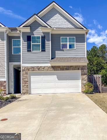 Fall in love with this stunning, meticulously kept townhome nestled in a quiet community complete with a park and pool. This 4-bedroom, 2.5-bathroom beauty sits on a spacious corner lot and boasts a large, private fenced backyard-perfect for hosting gatherings or enjoying peaceful evenings. Step inside to be greeted by an open-concept living area bathed in an abundance of natural light, featuring a cozy fireplace that adds warmth and charm. The sleek, modern kitchen is a chef's dream, complete with a large island, gleaming stainless steel appliances, and plenty of space to entertain or make your favorite meal. Retreat to the expansive primary suite, which offers a spa-like bathroom with a separate soaking tub and shower, double sinks and a generously sized walk-in closet. Additional perks include a 2-car garage, 3 additional bedrooms, lots of storage space and the almost new washer and dryer. Conveniently located just minutes from top-rated schools, shopping, dining, and Lake Lanier.