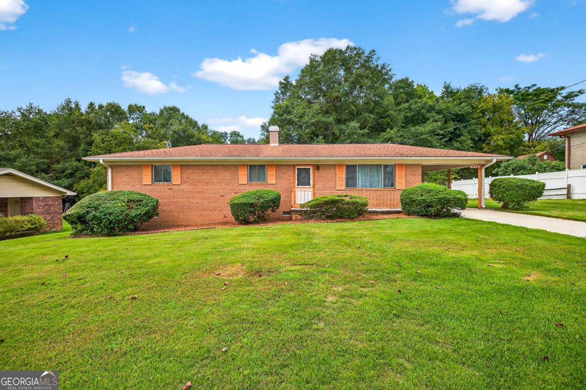 Welcome to 1529 Browns Bridge Road - an incredible opportunity to own a well-maintained, four-sided brick ranch just minutes from Downtown Gainesville! This home blends classic 1960s charm with outstanding potential for homeowners or investors alike. Step inside to find upgraded luxury vinyl plank flooring in the kitchen, a cozy brick, electric fireplace in the dining/secondary living area, and a new rear deck perfect for relaxing or entertaining-overlooking a beautifully manicured backyard. With over 21 feet of width, the oversized Primary Bedroom offers flexibility and space rarely found at this price point. The original floor plan also supports an easy conversion back to a 3-bedroom layout, adding even more value and versatility. Enjoy the freedom of no HOA and conveniently located just 3 miles from I-985, a mere minutes from shopping, dining, entertainment, and everything Gainesville has to offer. Whether youre looking to add personal touches and make this your next great home or an investor seeking a prime Gainesville location, this is a must-see property with tremendous upside. Homes in this price range and location are rare-schedule your showing today before it's gone!