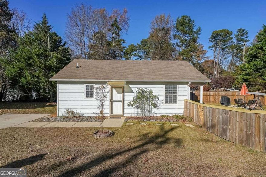 Sunny single-story home near GA-400 (Exit 16), Lake Lanier, shopping, restaurants, and local attractions including the Cumming Aquatic Center, Central Park, and public library. Features a spacious kitchen with pantry, oversized bath with soaking tub/shower, tile floors throughout, and washer/dryer connections with storage. Enjoy off-street parking, a fenced yard with storage shed, and beautifully landscaped grounds - ideal for first-time buyers or those seeking easy, low-maintenance living.