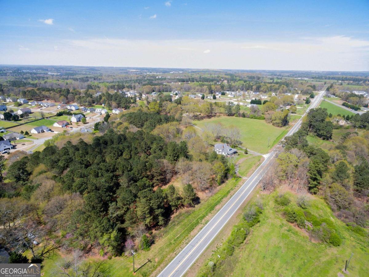 11 +- Acre property half a mile from Barrow Crossing! This is combined 3 lots. With the potential assemblage of 2 more. This area has seen expediential growth both in residential and commercial over the past 5 years & continues to grow. This lot is close to the future development of NEGA, Hobby Lobby, and many more to come. Publix, Target, Old Navy, TJMaxx, PetsMart, Michael's, Home Depot, Applebee's, IHOP, Zaxby's, as well as many more already call this area home. Willing to owner finance with favorable terms