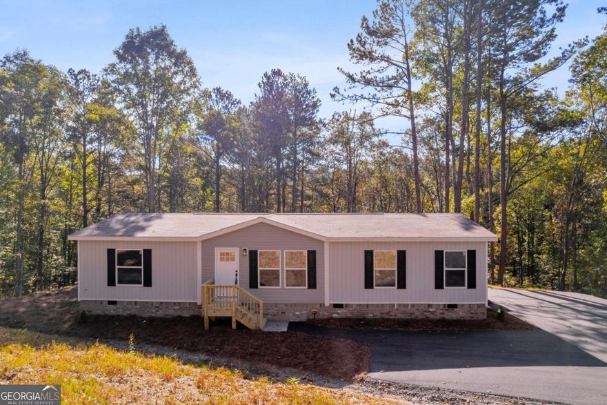 Welcome to your brand new home in Cherokee County!  This charming 3-bedroom, 2-bath residence offers a bright open floor plan, perfectly designed for both everyday living and entertaining. Nestled on 2.43 acres at the end of a quiet, private road with minimal traffic and a cul-de-sac, it provides the peace and privacy you've been looking for.    As you arrive, you'll love the picturesque street lined with quaint horse farms, making every drive home feel serene and relaxing. Though it offers the feel of a rural retreat, you're just minutes from the shops, dining, and charm of downtown Ball Ground.    Built with energy efficiency in mind, this Energy Star Rated home comes with exceptional peace of mind:   * 1-year full manufacturer's warranty   * Lifetime siding warranty   * 20-year shingle warranty   * 7-year AC warranty   * Warranties on all new appliances and systems    Financing options include USDA 100% loans, FHA, VA, and conventional loans, making this home even more accessible.    Cherokee County is where "the metro meets the mountains"-and this home captures the very best of both worlds. Don't miss the opportunity to make it yours!