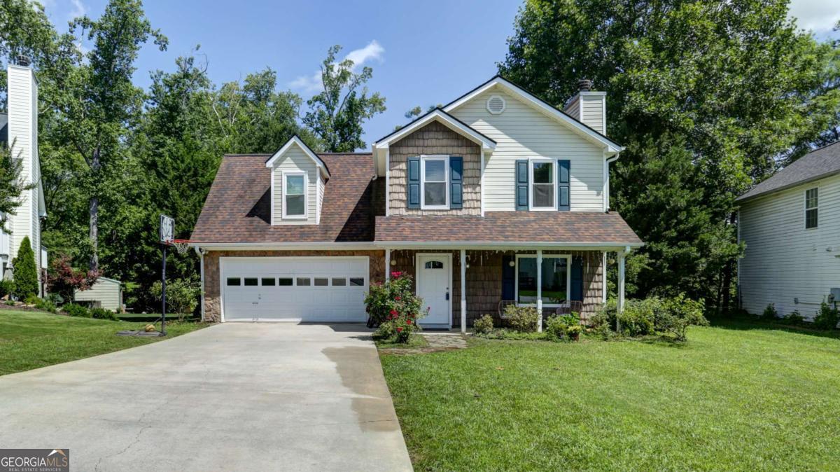 Charming 3BR/2BA Home in the Heart of Downtown Dawsonville with Bonus Room! This beautifully updated home offers the perfect blend of comfort, space, and convenience-all in a prime downtown Dawsonville location! Featuring 3 bedrooms, 2 bathrooms, and a HUGE bonus room, there's plenty of room for family, guests, or a home office. Recent upgrades include brand new hardwood floors (2025), new windows throughout (2024), HVAC replacement (2021), and a newer roof (2019). Enjoy granite countertops in both kitchen and baths, and take advantage of the front and rear irrigation system to keep your landscaping lush year-round. Step outside to your own private oasis-complete with a covered back porch, large storage building, and a well-maintained, landscaped yard. A hookup is already in place for a tankless water heater upgrade. Located just minutes from GA 400, Hwy 53, and Hwy 136, you'll love being close to shopping, dining, schools, parks, and all that downtown Dawsonville has to offer!.