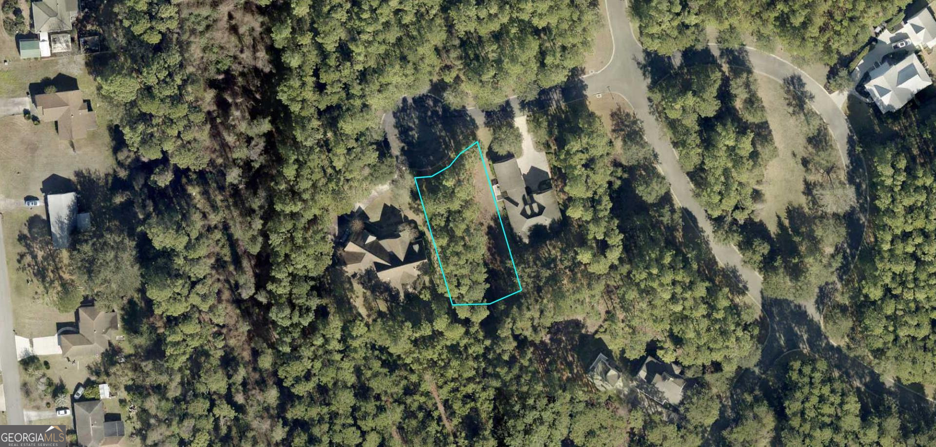 Build your dream home on this serene wooded homesite at 105 Burgee Place, nestled on a quiet cul-de-sac in the prestigious Cumberland Harbour community of historic St. Marys, GA. This gated, waterfront community offers the perfect blend of natural beauty and resort-style amenities. Enjoy privacy and tranquility surrounded by mature trees, just minutes from the charming downtown of St. Marys and within easy reach of Jacksonville, FL and Savannah, GA. Cumberland Harbour features 24/7 manned security and a wealth of amenities including three resort-style pools, a fitness center, day dock for kayaking and boating, tennis courts, pickleball, playgrounds, and scenic nature walks. Whether you're looking for a primary residence, a vacation retreat, or an investment in the coastal lifestyle, this homesite offers a rare opportunity in one of Georgia's most desirable coastal communities.