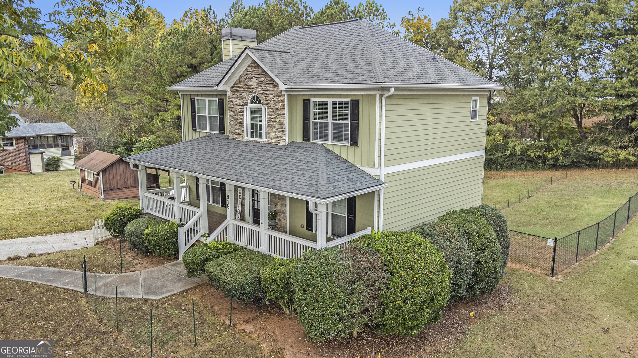 MOTIVATED SELLER - Location, Location, Location! Come home to spacious Southern living just ten minutes north of Marietta Square with the front porch you've always dreamed of! Enter into the welcoming family room with fireplace, hardwood floors, and a roomy country kitchen - Plenty of open space and storage throughout the home for comfortable living. Unfinished basement offers wonderful storage or an opportunity to finish for additional living space. Don't miss the charming crown molding throughout the home! The kitchen boasts stainless steel appliances, stone counters, and a separate dining room! The primary bedroom features tray ceilings, a beautiful double vanity, a separate shower, a spa-like soaking tub, and a large, walk-in closet! Two generously sized secondary bedrooms share a bathroom on the upper level in this split floorplan with laundry upstairs! Relax on the large back deck overlooking the scenic backyard. Beautiful, large, level, fenced lot with a giant Fig tree to start your garden!! Your dogs will LOVE this yard! Room to expand this adorable home or add a guest house, outbuilding, workshop, or garden! Just minutes from all the shopping in Town Center Kennesaw. Just minutes from Historic Marietta Square dining and EASY access to the freeway! Close to Kennestone Hospital, great schools, & more! No HOA! Great parking for your RV or travel trailer. Don't let this be the one that got away!