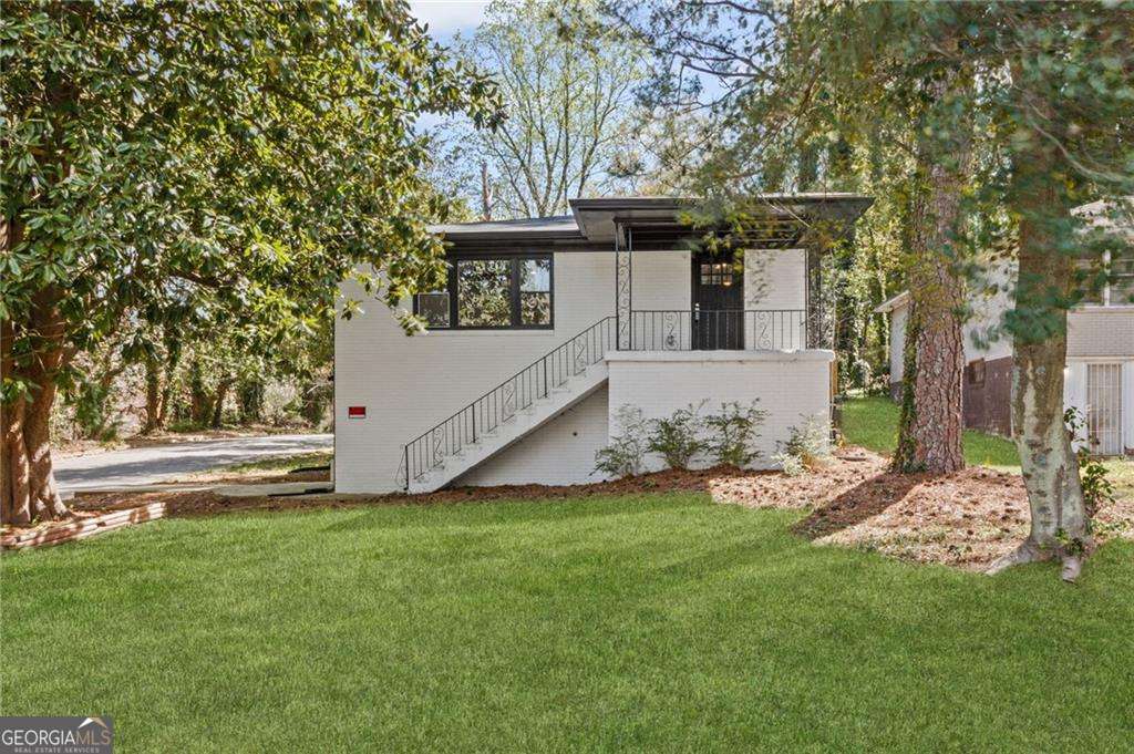 REO property out of TEXAS offering $10,000 buyer credit for closing before 5/31/2025. Incredible ALL BRICK TOTAL RENOVATION on a beautiful corner lot. It's like two homes in one with a fully finished terrace level featuring TWO SEPARATE EXTERIOR ENTRANCES. New roof, new window, new kitchen, THREE NEW BATHROOMS, new luxury vinyl flooring throughout and brand new HVAC and HWH. The list of upgrades at this price point is long! Quartz countertops in the kitchen with all stainless steel appliances. Large center island and tons of cabinets. The primary suite features an abundance of closet space and an en-suite bath with a double vanity and GIGANTIC walk in shower. The secondary, main level bedroom, is large and bright with good closet space. The FULLY FINISHED TERRACE LEVEL, with two separate entrances, would make a great in-law suite or PERFECT RENTAL with plenty of finished space to add a small kitchen. The terrace offers a HUGE OPEN AREA for entertaining, two bedrooms and really nice full bathroom.