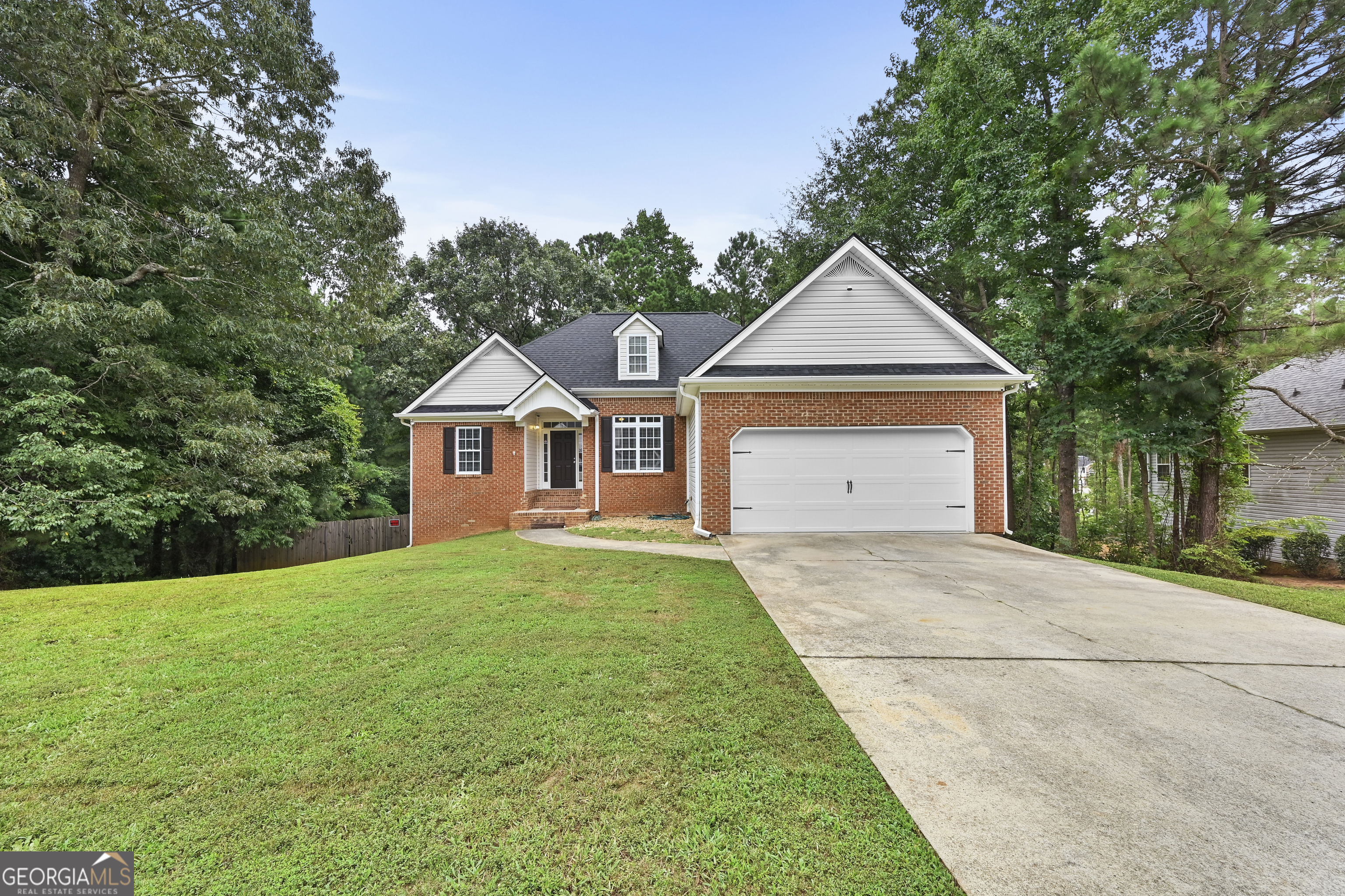 This beautifully updated 5-bedroom, 3 bathroom home offers over 3,000 sq. ft. of finished living space on an expansive .70 acre lot in one of Powder Springs' most desirable communities. From the moment you arrive, this home sets a peaceful tone for the elegance inside. Step into a bright, inviting interior featuring well maintained hardwood flooring, fresh designer paint, and abundant natural light. The spacious living areas flow seamlessly, with a well-appointed kitchen perfect for cooking and entertaining. Downstairs, a fully finished basement with 2 large bedrooms, spacious full bathroom and additional rooms offers endless possibilities- maybe a private rental apartment.The fenced backyard is your own private oasis. Relax or entertain on the expansive wood deck or enjoy outdoor activities in the lush yard. This great lot provides added privacy, mature landscaping, and plenty of room to garden or play. This home has been thoughtfully updated-giving you peace of mind for years to come. The attached 2-car garage adds convenience and storage space.Located minutes from parks, shopping, dining, medical centers, and top Paulding County schools, this home combines comfort, style, and location. Key Features: 5 Bedrooms / 3 Full Baths 3,005 sq. ft. finished living space + finished basement + fenced backyard Recent upgrades: flooring, paint, appliances, roof, HVAC, water heater Large .70-acre lot in The Enclave at Brownsville Don't miss your chance to own this rare find in Powder Springs-schedule your private tour today and experience all that 422 Enclave Drive has to offer!