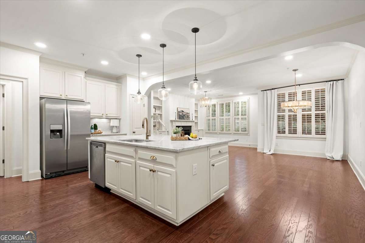 DON'T MISS THIS OPPORTUNITY TO SPEND THE YEAR JUST ONE BLOCK FROM DOWNTOWN ALPHARETTA enjoying some of the best food, shopping, and lifestyle living that metro Atlanta offers. This beautiful TOWNHOME in the gated HAYNES PARK COMMUNITY is perfect for renters seeking to enjoy all that the area offers. Built by John Weiland Homes known for its QUALITY and LUXURY craftsmanship. SHOWS like a MODEL. High-end finishes include gorgeous REAL HARDWOOD FLOORS, VAULTED CEILINGS, new LIGHT FIXTURES, NEW CARPET, deluxe 4" PLANTATION SHUTTERS, luxury BUILT-INS, and oversized 2-car garage. This home is perfect for entertaining with the spacious OPEN CONCEPT floor plan, and CHEFCOS KITCHEN boasting, White Cabinets, MARBLE Countertops, Updated door hardware, luxury lighting, and STAINLESS APPLIANCES INCLUDING A SIDE-BY-SIDE REFRIDGERATOR. SPACIOUS adjoining family room with COZY FIREPLACE. Extra WIDE stairs open to the upper floor that features a HUGE VAULTED Owner's Suite, that boasts a fabulous spa with separate vanities, jetted tub, an OVERSIZED shower, and a Huge walk-in CLOSET. In addition, the upstairs features TWO additional GENEROUSLY SIZED GUEST rooms both with large closets and an additional full bathroom. The upper floor also features A FABULOUS FLEX SPACE/ROOM that could be used as an OFFICE OR FAMILY ROOM. Washer and Dryer included with the LAUNDRY room conveniently located upstairs near the ownerCOs suite. Walkout to your PRIVATE SCREENED IN PATIO complete with a fenced backyard. Also, donCOt miss the extra ceiling storage in the garage. This FRIENDLY and BEAUTIFULLY MAINTAINED community is just STEPS away from all the SHOPPING, RESTAURANTS, PARKS, ALPHA-loop TRAILS, and ACTIVITIES that downtown ALPHARETTA has to offer. THIS AMAZING RENTAL OPPORTUNITY WONCOT LAST LONG