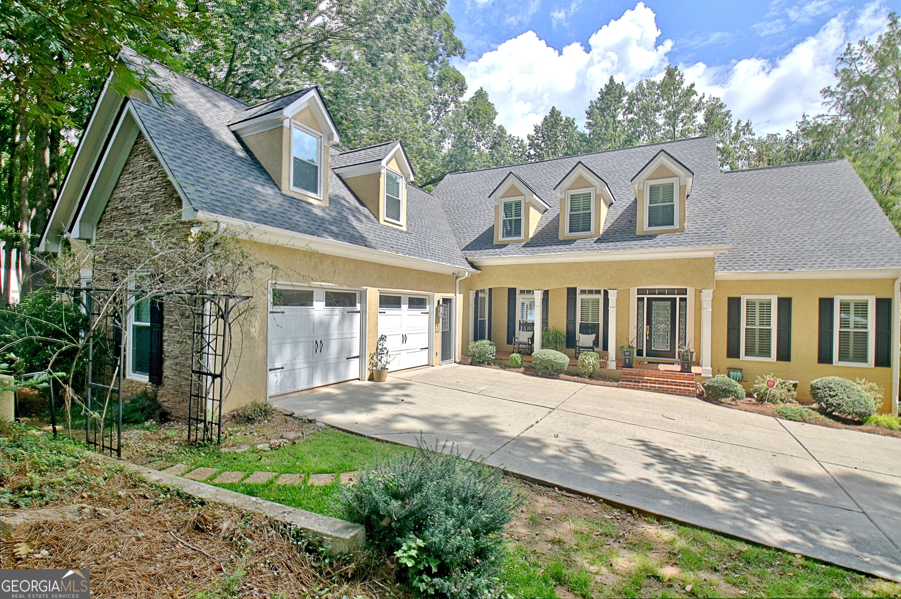 PRIDE OF OWNERSHIP echos throughout this home! Nestled behind mature, professional landscape lies this meticulously kept home on Lake Kedron just waiting on it's next owner! Enjoy the privacy of each outdoor space, the views of the lake as it peeks through the trees, and all of the bonus spaces to host parties or accommodate long term guests. Every inch of this home has been thoughtfully updated and all major systems new: 2 1/2-year-old windows, 2-year-old roof, 2-year-old water heater, new appliances, 3 newer HVACs. The house is truly MOVE IN READY!!! Main floor has freshly stained hardwoods throughout, fresh paint, updated lighting, and double-sided fireplace. Master on main with fully renovated master bath and custom closet. Upstairs are three additional bedrooms all with hardwood floors. One room has an ensuite and the other two share jack and jill bath. Basement is HUGE with soaring ceilings, full kitchen, bedroom, full bath, a second laundry room, home gym, home theater, AND massive game room overlooking second deck! Basement has it's own entrance from the side of the house and a golf cart garage. Great for generational living! Also with it's own entrance from the garage is a detached guest suite with a full bath. SO MANY POSSIBLIITIES with all this space. Home is located close to it's award-winning schools, Lake Kedron, and the multi-use golf cart path. Easy access to airport and interstate from this North Peachtree City location too. This home really does have it ALL!