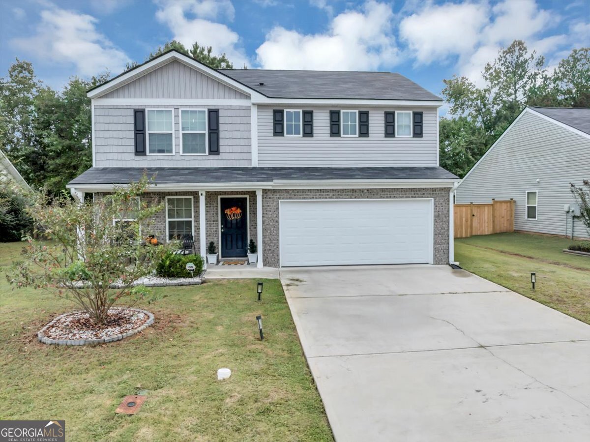 Welcome to Walton Creek! This beautiful 4 bedroom, 3 bath home is filled with charm and modern comfort. Enjoy relaxing on the inviting front porch before stepping inside to a bright, open-concept main level designed for today's lifestyle. The spacious kitchen features white cabinets, solid surface countertops, stainless steel appliances, and LPV flooring that flows seamlessly throughout the main floor. The main level also features a bedroom for added convenience and full bath with solid surface countertops. Upstairs, you'll find an open loft area, an oversized primary suite with a spa-like bathroom, a large walk-in closet, and spacious secondary bedrooms. Outside, the private backyard is perfect for entertaining and includes a cozy fire pit. Move-in ready and located in a well established neighborhood with NO HOA and just minutes from shopping and dining. This Walton Creek gem is one you don't want to miss!
