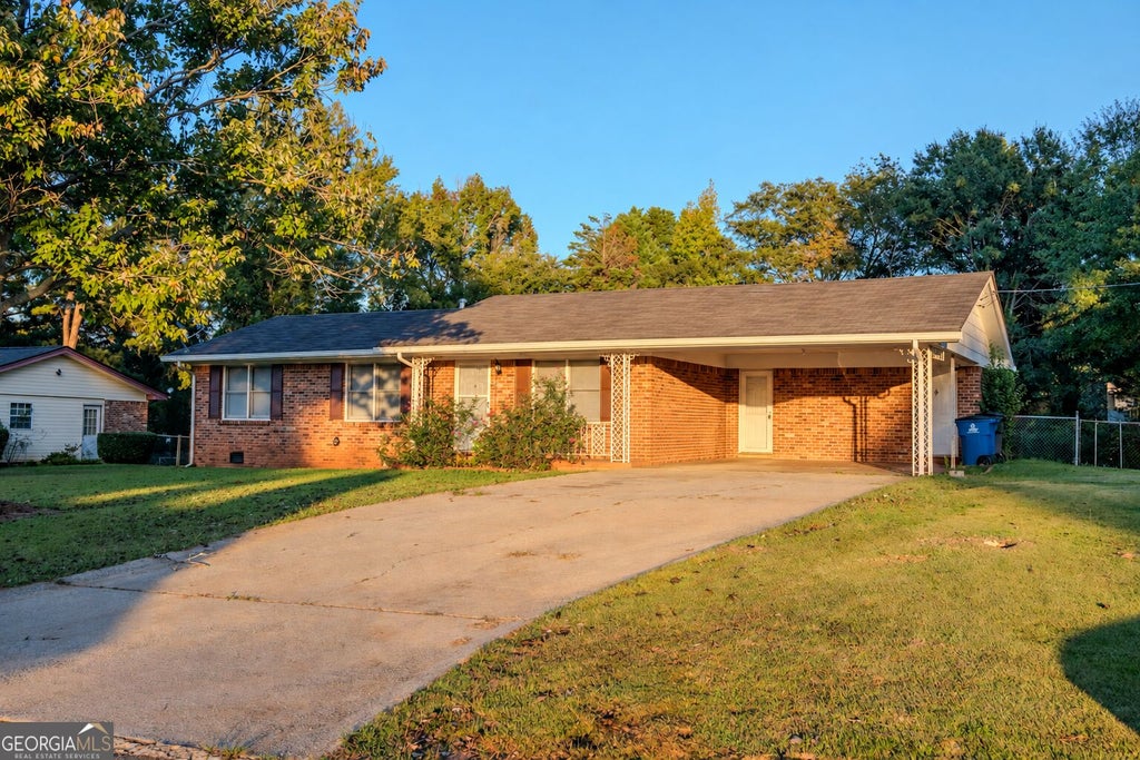 Photo of 7466 Ann Street, Riverdale, GA 30274 (MLS # 10872975)