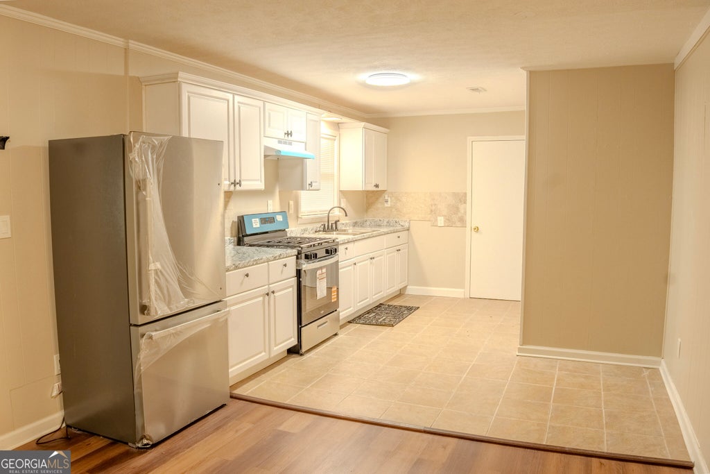 Photo of 7466 Ann Street, Riverdale, GA 30274 (MLS # 10872975)