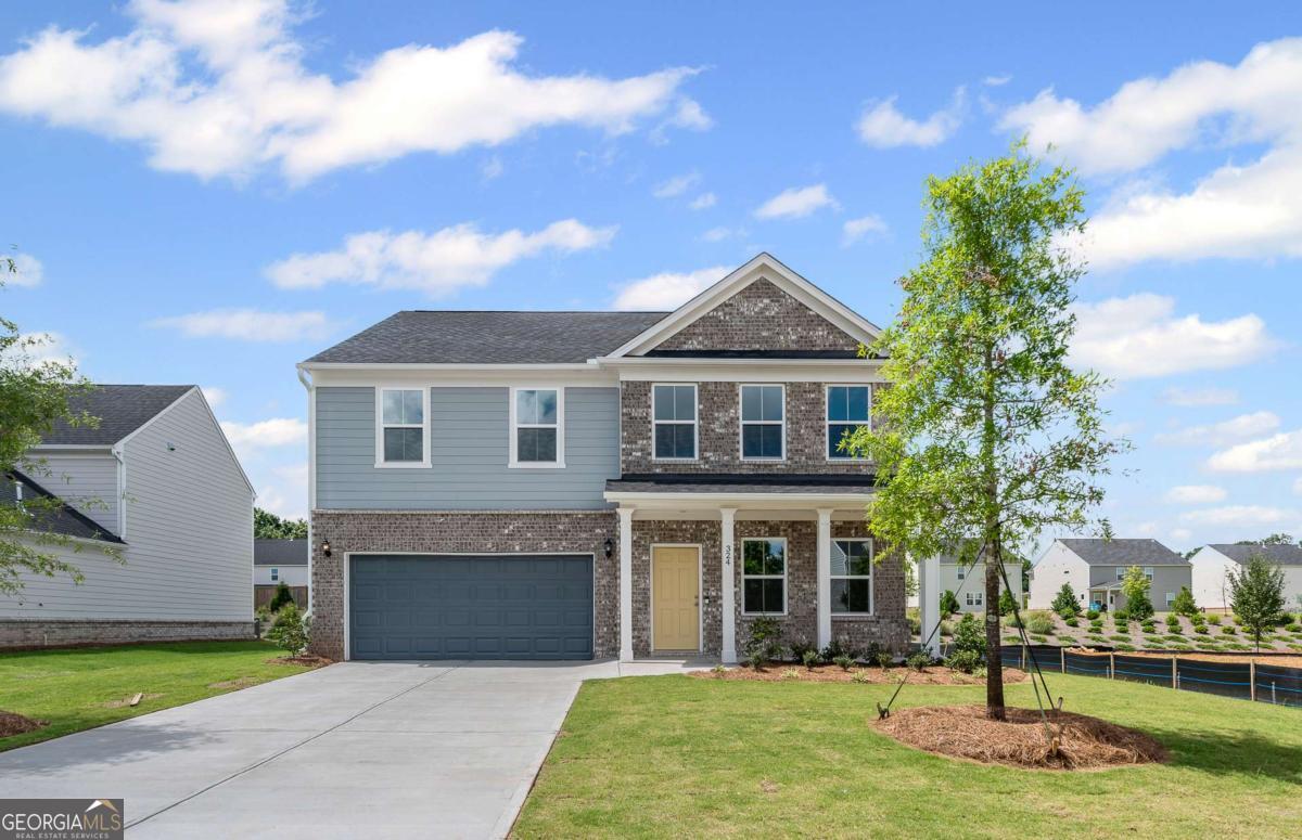 Move-In Ready! Step into your dream home with this beautifully crafted new construction home in the highly sought-after Hawthorne Ridge community, perfectly situated near Mt. Carmel Road and Highway 81. This spacious and stylish Hampton floorplan offers the ideal blend of comfort, flexibility, and upscale finishes. From the moment you walk in, you'll love the thoughtful design. A main-level office or study provides a quiet space to work or unwind, while a guest bedroom and full bath offer convenience and privacy for overnight visitors. The heart of the home is the open-concept kitchen with views to the family room. Ideal for entertaining or relaxing with family. The gourmet kitchen features a large island with quartz countertops, white cabinetry, and modern finishes that elevate everyday living. Upstairs, a versatile loft adds extra living space perfect as a media room, play area, or second lounge. With a two-car garage and plenty of room to grow, this home checks every box. Located just minutes from I-75, Henry Town Center and McDonough Square, Hawthorne Ridge offers unbeatable access to top destinations like Georgia National Country Club & Golf Course, Tanger Outlets, Jackson Lake, North Mt. Carmel Park, and an abundance of local restaurants and shops. Enjoy resort-style living with community amenities that include a pool and cabana, clubhouse with catering kitchen, grilling pavilion, firepit gathering area, dog park, and charming pocket parks throughout the neighborhood.