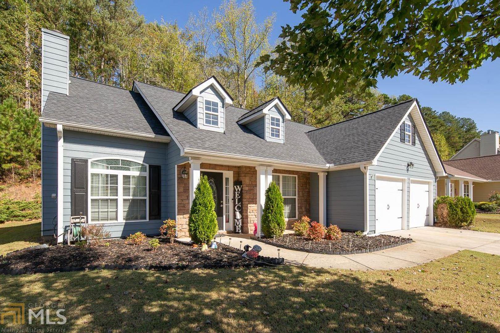 Sought after ranch style home in the heart of Dawsonville. Inviting vaulted living area with wood-burning fireplace. Kitchen is open to the living room with tons of cabinet space, pantry and eat-in breakfast nook. Master bedroom with ensuite bath and large walk-in closet. The two-car garage has been converted to a playroom but would work perfectly for a home office or can be easily converted back to a garage to meet your needs. Back patio perfect for grilling. New roof installed and new fade resistant exterior paint - Aug '19