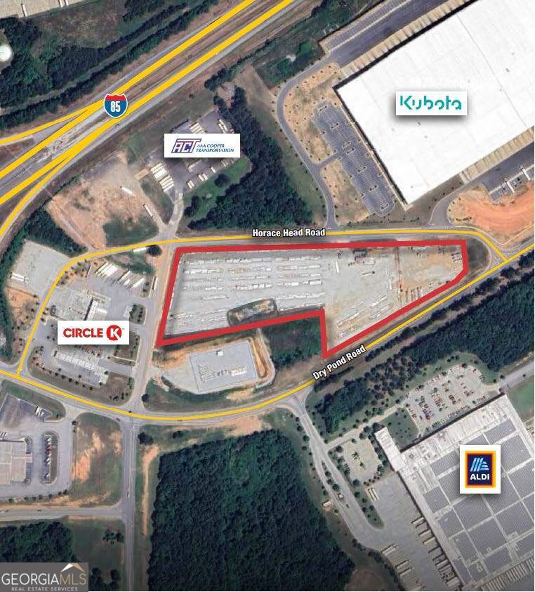 NAI Brannen / Goddard is proud to present for your consideration this 9.32 +/- acre tract of industrial / commercial acreage situated in Jefferson / Jackson County, Georgia. The site is currently utilized as an industrial storage lot and lay-down yard. The property is fenced, graded, and graveled and ready to park trucks, trailers, equipment and inventory or be developed. The site is located less than a quarter mile from Interstate 85 Exit 140 and has frontage along both Dry Pond Road and Horace Head Road with access along Horace Head Road for convenience. All utilities including sewer are available. There is a new truck stop / convenience store located adjacent the property that would conveniently supply fuel needs to a fleet of trucks and equipment. A neighboring 1.50+/- acre tract could be added to take the property all the way to the corner of Dry Pond Road and Horace Head Road. There are tons of industrial users in the area along the I-85 corridor with no end in development in sight. This could be a BTS for a warehouse as well for the right tenant / user.