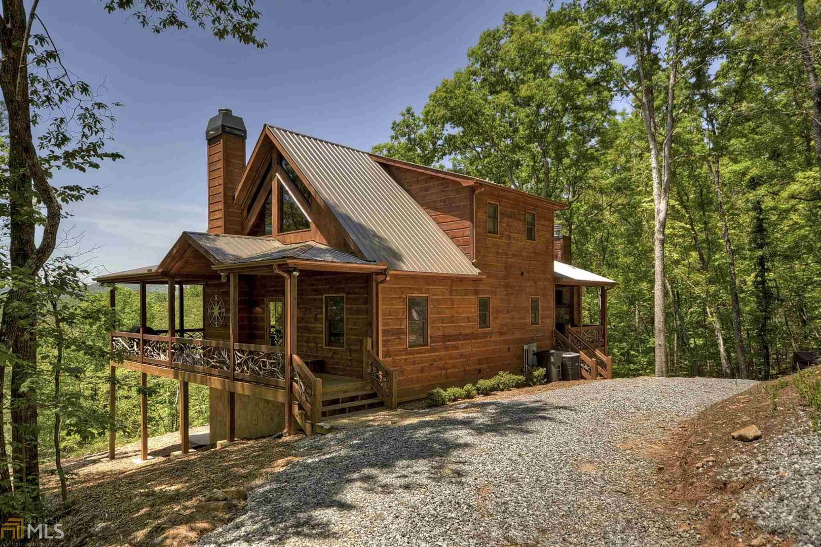 This is a beautiful cabin with year round mountain view AND easy access to the Toccoa River! It is located in the Fish Camp subdivision, with quick access to downtown Blue Ridge. This is a trout fisherman's dream cabin with access to the Toccoa River only a few hundred yards away at the Curtis Switch TVA access park. Launch or take out your drift boat or kayak at the concrete ramp, or wade in and fish one of the best fishing locations on the tailwater of the Toccoa River. The cabin has a wrap around deck with loads of outdoor space, including a beautiful outdoor fireplace and sitting area. The lower level includes a bedroom, full bath, game room, and a bonus bunk room for the kids. The cabin is in a successful rental program and comes mostly furnished.