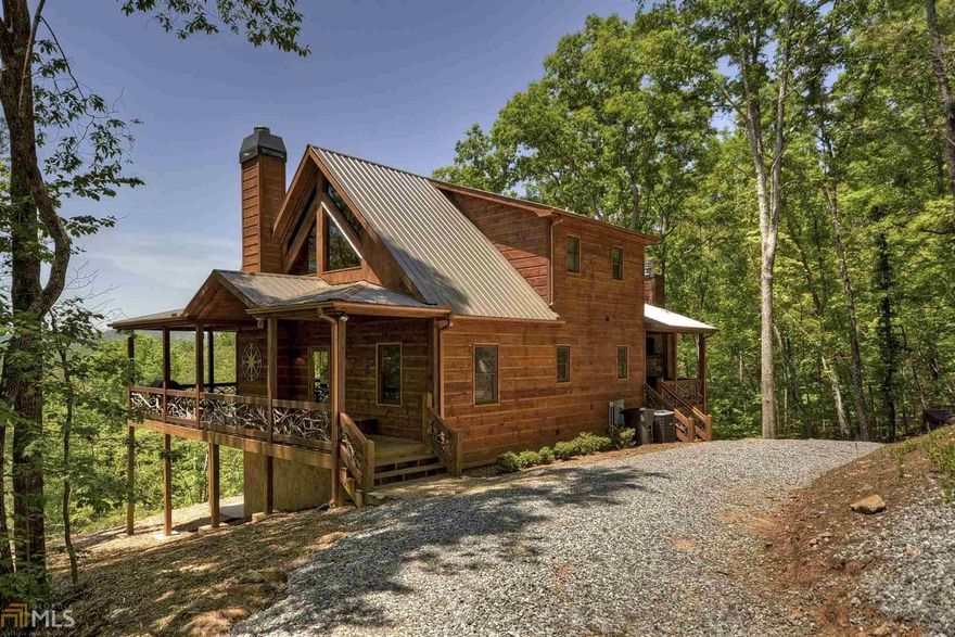 This is a beautiful cabin with year round mountain view AND easy access to the Toccoa River!  It is located in the Fish Camp subdivision, with quick access to downtown Blue Ridge.  This is a trout fisherman's dream cabin with access to the Toccoa River only a few hundred yards away at the Curtis Switch TVA access park.  Launch or take out your drift boat or kayak at the concrete ramp, or wade in and fish one of the best fishing locations on the tailwater of the Toccoa River.  The cabin has a wrap around deck with  loads of outdoor space, including a beautiful outdoor fireplace and sitting area.  The lower level includes a bedroom, full bath, game room, and a bonus bunk room for the kids.  The cabin is in a successful rental program and comes mostly furnished.