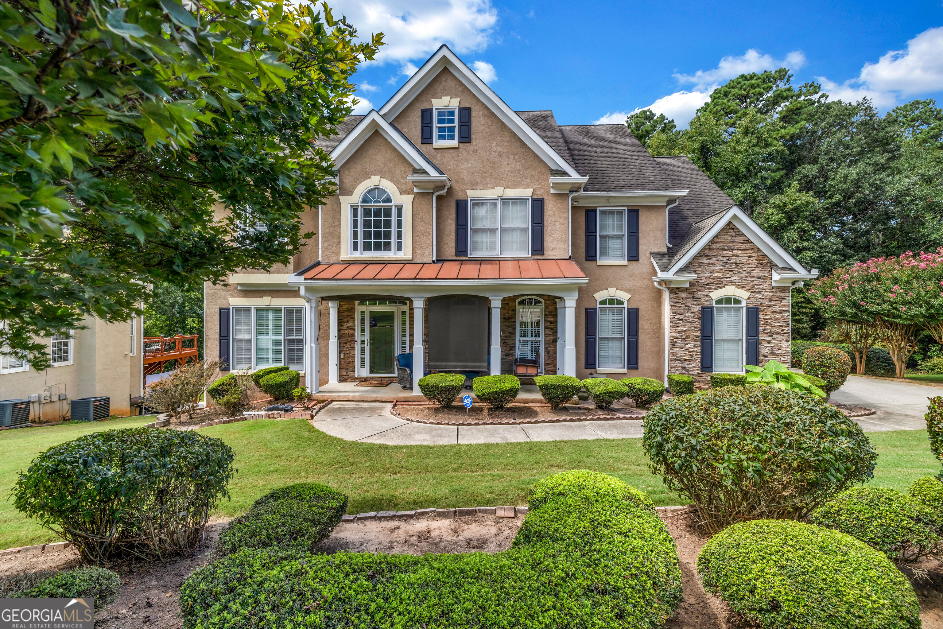 Step into sophistication with this stunning 5BR|4.5BA home featuring a spacious 3-car garage and a thoughtfully designed layout that blends timeless charm with modern versatility. Soaring ceilings greet you in the entrance foyer and great room, creating an airy, elegant atmosphere filled with natural light that sets the tone for the entire home. Inside, it boasts new luxury vinyl plank flooring throughout (excluding the basement), freshly painted cabinets with sleek new kitchen knobs, and a brand-new double oven that anchors the heart of the kitchen. Dual staircases provide easy access to the second floor, where the expansive owner's suite features a peaceful sitting area and a beautifully updated ensuite with a double vanity, separate shower, and walk-in closet. Two adjoining bedrooms share a convenient Jack and Jill bathroom, while a separate bedroom offers added privacy. Every bathroom showcases new tile flooring, and the home is enhanced by new lighting fixtures and updated plumbing fixtures, creating a cohesive and contemporary feel. The front entrance staircase is accented with elegant wrought iron rails, and the front porch is fitted with custom sunshades for added charm and comfort. Downstairs, the basement offers a private entrance, a fifth bedroom, and flexible space ideal for a full in-law suite, gym, game room and even a modern salon or barber shop, thanks to an adaptable footprint. Fresh paint throughout completes the transformation, making this home move-in ready for buyers seeking space, sophistication, and lasting value in a community with water park-themed amenities. Don't wait; schedule your private showing today!