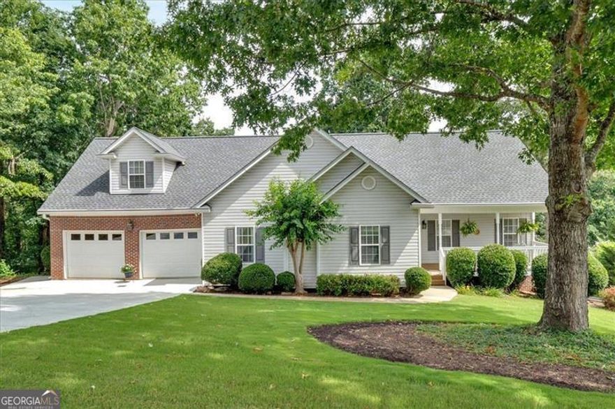 Step into this lovely home today, and you'll want to make it yours!  With 3 bedrooms, 2 bathrooms and an upstairs bonus room, there's room for all your needs.  Enjoy the beautifully landscaped yard, spacious front porch with a newly painted back deck where you can enjoy peaceful mornings or relaxing dinners outside.  Inside, the open plan invites you into the living room with its cozy fireplace and kitchen with granite countertops.  There's plenty of storage room downstairs, with a full unfinished basement that's stubbed for another bathroom, should you choose to do that.  Two driveways! The main driveway is less than 1 year old, the HVAC system has been maintained yearly and the roof is new, too.  With its wonderful location in Cartersville, you'll be living in a peaceful, well-kept neighborhood - close to schools, shopping, restaurants, hospital and world-class museums.  Set up your showing appointment today!
