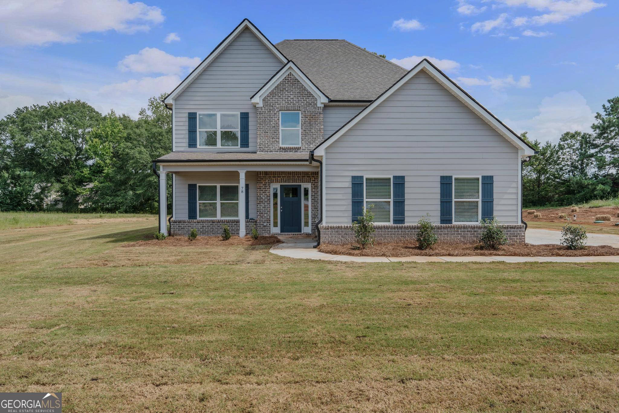 This large home features a guest suite on the main level, an open kitchen and family room, and a separate dining room perfect for entertaining. Upstairs, you'll find the master suite along with three additional bedrooms. Enjoy peaceful outdoor living with a covered back patio, all set on a beautiful 2+ acre lot in a highly sought-after school district.