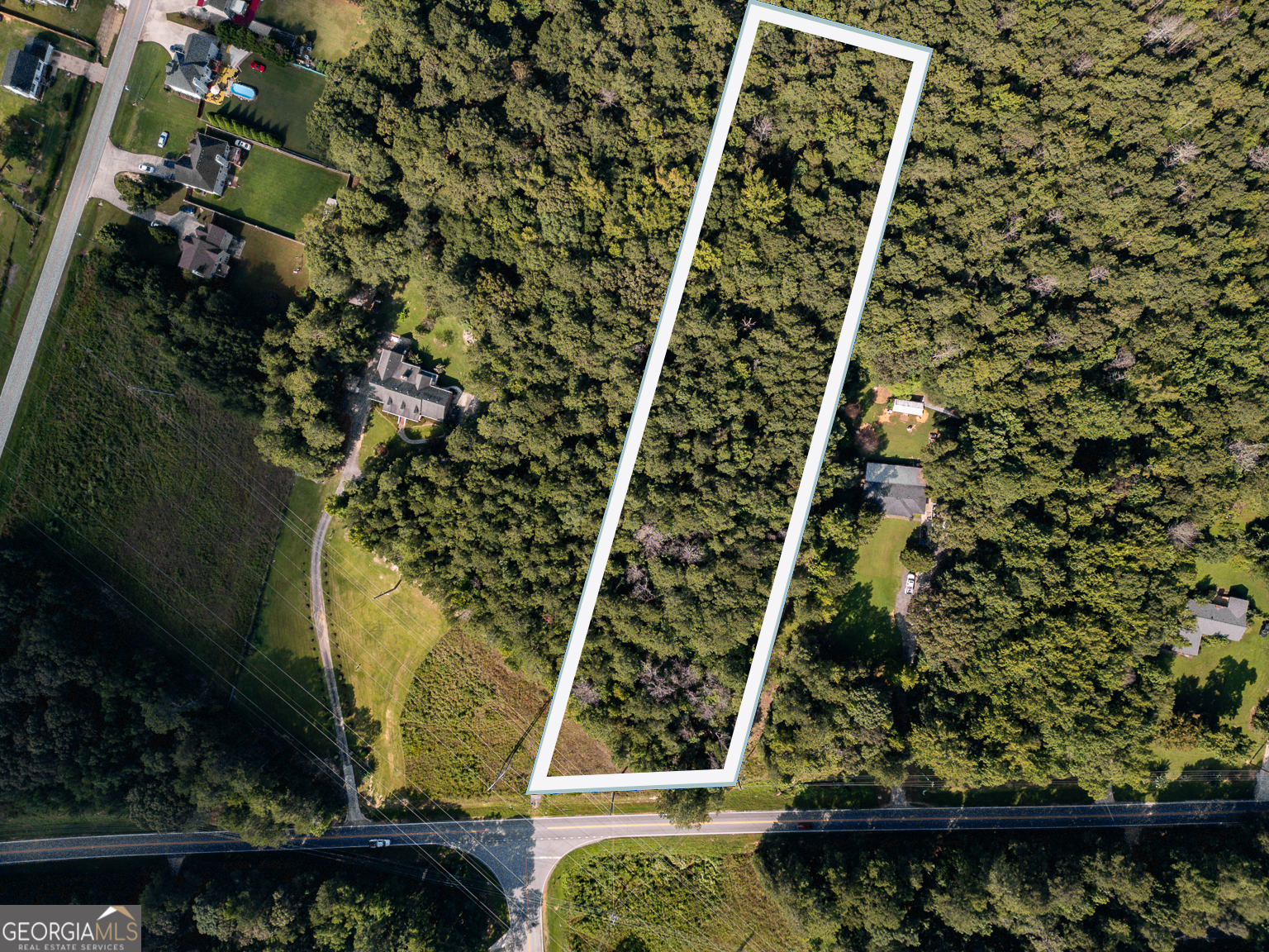 Build Your Dream Home on 3.57 Acres with no HoA, in Covington, GA! Don't miss your chance to own 3.57 wooded acres on Crowell Rd, just 10 minutes from downtown Covington and 45 minutes from Atlanta. This gently sloped lot (640-660 ft elevation) features 175 feet of paved road frontage with water, power, and propane available making it a perfect investment for home developers. Zoned Agricultural Residential (A-R), you can build a single-family home (site-built, modular, or Class A manufactured) with potential for a tiny home as an accessory dwelling. This lot offers subdivide potential, No HOA, proximity to shopping, dining and area attractions such as Cedar Shoals Park, Walker Marina, and the Atlanta Botanical Garden. Large lots in Newton Wood are rare-so act fast to secure this great investment opportunity before it's gone! Newton Wood subdivision Lot #11, Parcel ID 0044000000097000 (44000000097000).