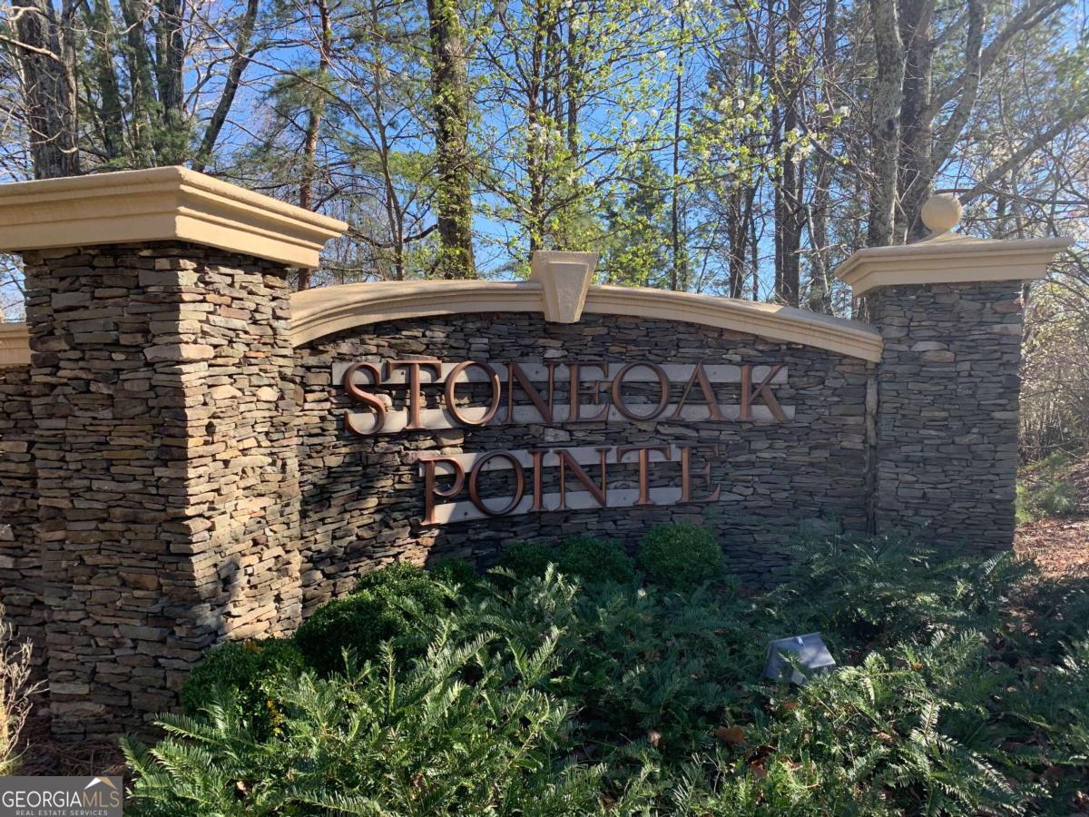 Tremendous opportunity, folks! Build the home of your dreams in amazing, highly sought-after East Cobb! This huge 1.1+/- acre corner lot gives you total privacy and is perfectly sloped for a basement-very important, very desirable! Located in the fantastic Stoneoak Pointe subdivision, near top-tier Wheeler High School in the incredible, nationally recognized Cobb County school district-one of the best! This neighborhood? Absolutely first-class! You've got a beautiful pool, great tennis courts, a wonderful clubhouse-everything you want! And let me tell you, the location is unbeatable. Just minutes from I-75, Marietta Square, parks, fantastic shopping, incredible dining-everything! Plus, you're close to SunTrust Park, the Battery-so much to do, folks! And here's the best part-it's BUILDING PERMIT READY! All utility taps are already there-just needs development. Don't wait-this is a winner, a total winner!