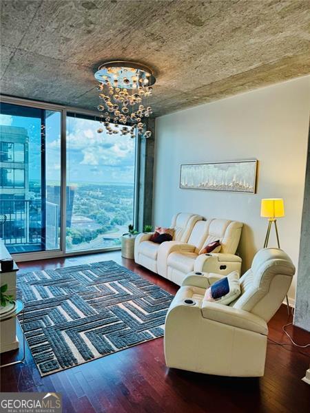 Elevated Elegance in the Heart of Atlanta! Welcome to a sophisticated sanctuary in the sky-this 34th-floor residence at 400 W Peachtree St NW delivers an extraordinary blend of modern luxury and sweeping skyline views from one of Atlanta's most prestigious high-rise addresses, Twelve Centennial Park. Step into a thoughtfully designed open-concept living space where floor-to-ceiling windows bathe the interior in natural light, highlighting rich hardwood floors and high-end finishes throughout. The gourmet kitchen is a culinary masterpiece, appointed with sleek granite countertops, stainless steel appliances, and a stylish breakfast bar-ideal for hosting or quiet mornings overlooking the city. Retreat to the expansive primary suite, where dramatic city views set the stage for relaxation. Enjoy a spacious walk-in closet and a spa-inspired ensuite bath with granite countertops and a tub/shower combo, perfectly balancing function and flair. Additional features include in-unit laundry, an assigned parking space, and exclusive access to world-class amenities: a 24-hour concierge, resort-style rooftop pool, modern fitness center, private clubroom, business center, theater room, valet services, conference room, and a private dog park. Located steps from Centennial Olympic Park, the Georgia Aquarium, State Farm Arena, Mercedes-Benz Stadium, and the city's premier dining and entertainment, this residence places you in the heart of Atlanta's vibrant pulse-while offering the serenity of an elevated private escape. Positioned near the transformative multi-billion-dollar Centennial Yards development, this home is not only a luxurious primary residence but a savvy long-term investment. The building's well-managed HOA enhances community living with frequent social events and financial stability. Experience the height of urban luxury-schedule your private showing today.