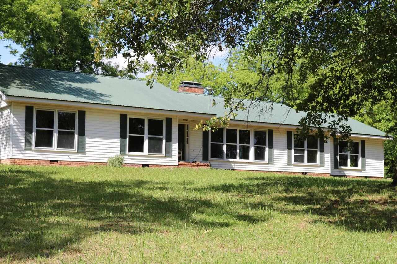 Great house but in need of some TLC. 5.06 acres, fencing, pasture, mature pecan trees, so many possibilities. Seller is still moving and cleaning up. A must see!!! The D/W has been sold and will be removed.