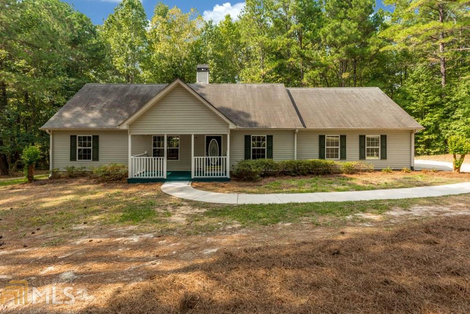 Totally renovated 3BR 2BA on tranquil 2+ acres with creek in the back. This home has abundant storage! His and her walk in closets in the master, 3 kitchen pantries, and extra closets in the hall. Master BR has trey ceilings and large bath with whirlpool tub, oversized double sink with lots of drawers. Cozy up in the living room with a wood burning fireplace! This home features a walk in attic that has been fully floored, space the could be finished, and thermal insulation shield has been added. Generous two car garage with work bench area and peg board wall. Wonderful split BR plan, with private upstairs bonus room.