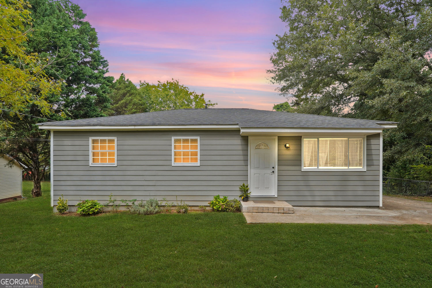 Welcome to this charming ranch home located in a quiet NO-HOA community! This move-in ready home features a functional layout, new LVP flooring, fully renovated kitchen with granite countertops and white cabinetry, updated bathrooms, custom laundry room, fresh paint, updated roof and more. Step inside to find a bright living area that flows into the spacious eat-in kitchen. Outside, the large backyard is perfect for gatherings, pets, or gardening. The home also includes an extended driveway for ample parking and a separate side-entry for added convenience. Conveniently located near downtown Snellville, shopping, dining, schools, and parks with easy access to major highways. An amazing opportunity awaits for you as a first time home buyer or an investment property. This spacious ranch-style home won't last long!