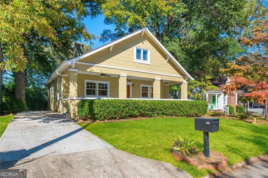 Berkeley Park bungalow-updated where it counts. Classic front porch welcomes you to fireside living and arched dining that flow into a fully renovated kitchen with white shaker cabinetry, expansive quartz counters, gas range, stainless suite, and island + peninsula seating. The main-level owner's suite adds everyday ease with a double-vanity bath and walk-in glass shower, opening to a large entertaining deck and a fenced, usable yard. Upstairs delivers two bedrooms plus a bright office/flex 3rd bedroom with built-ins and a skylight, with additional baths positioned for guests and day-to-day. A covered 2-car carport and ample storage round out the livability.  Lives like 3BR/3.5BA at roughly ~2,100 sq ft (see floor plan) on a quiet, walkable Berkeley Park street-moments to Westside Provisions District, minutes to The Works and Westside Park, with quick I-75 access and GA Tech/Midtown close by.