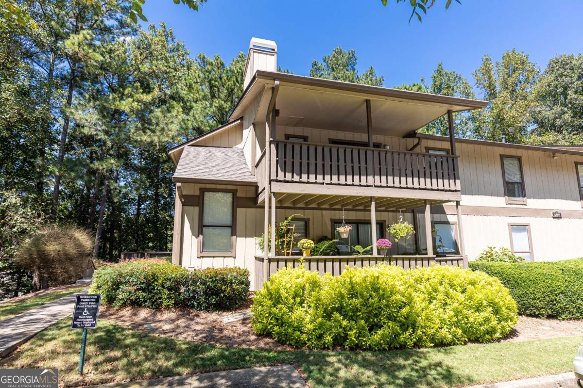 Welcome to this beautifully updated top-floor corner unit in the highly sought-after Woodcliff community. Surrounded by a tranquil wooded setting, this light-filled condo offers stylish upgrades, thoughtful design, and a peaceful retreat from the city. Step inside to discover a renovation that has created an open-concept layout where the thoughtfully remodeled kitchen seamlessly flows into the living and dining areas. Highlights include custom white cabinetry with additional cabinetry in the breakfast bar, stainless steel appliances, granite countertops, and a fresh lighting package. The ceilings have been scraped for a polished look, and the neutral gray and white tones provide a timeless aesthetic throughout. The living area features a gas-lit fireplace, built-in bookcases and a glass slider leading to a large, covered balcony, perfect for relaxing or entertaining. The oversized primary bedroom includes a walk-in closet, and the updated bathroom shines with dual sinks, a new tub, and sleek tile finishes. Additional conveniences include an in-unit laundry room, deep storage closets, and updated systems, including a newer AC and hot water heater. Woodcliff is a well-maintained, owner-occupied community with low HOA dues and rental restrictions in place to ensure long-term care. Residents enjoy exceptional amenities, including a saltwater pool, tennis and pickleball courts, and sidewalks for leisurely strolls. Located in the heart of North Springs/Sandy Springs, this condo offers unbeatable convenience with quick access to GA-400, the North Springs MARTA station, top-rated schools, restaurants, retail, and more. Don't miss your chance to own this exceptional property in a community that truly has it all-schedule your tour today!