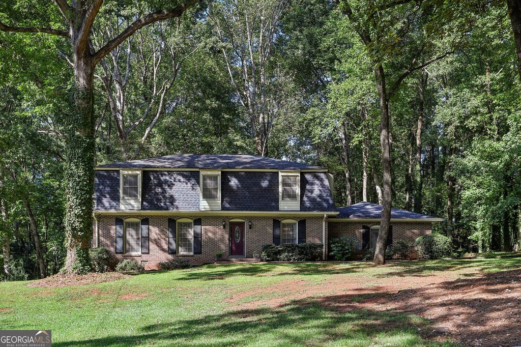 Photo of 4988 Mountclaire Road, Stone Mountain, GA 30087 (MLS # 10852805)