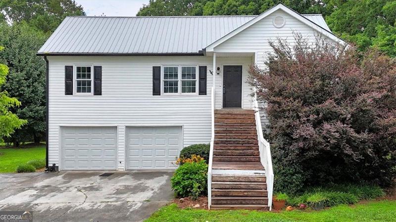 Welcome home to this charming 3 bedroom, 2 1/2 bath home located in a quiet neighborhood with stunning views of Pine Log Mountain. This home also features a large bonus room on the lower level with a half bath that already has plumbing in place to easily add a tub or shower. This home is easy to maintain with vinyl siding and metal roof. No HOA!