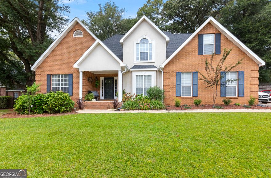 Welcome Home!  This fantastic 5-bedroom, 4-bath home offers 2,581 sqft of comfortable living space on a spacious .40-acre lot, nestled in the desirable Harper's Ridge Subdivision.  Step into the inviting foyer that opens into a bright living room featuring soaring ceilings, warm wood flooring, and a cozy gas fireplace. Just off the entryway, you'll find a formal dining room, perfect for hosting gatherings and special occasions.  The kitchen boasts abundant white cabinetry, a breakfast area, and easy access to the spacious laundry room with built-in cabinets for extra storage.  On the main floor, the primary suite includes a walk-in closet and a large en-suite bath with a double-sink vanity and soaking tub. Also on the main level is a versatile additional room with its own full bathroom - ideal for a home office, in-law suite, or man cave.  Upstairs, you'll find three more bedrooms and a full bathroom, providing plenty of space for family or guests. The bonus room, featuring carpet flooring, offers flexibility for a playroom, media room, or hobby space.  Enjoy the outdoors year-round in the enclosed back porch, perfect for relaxing or entertaining.