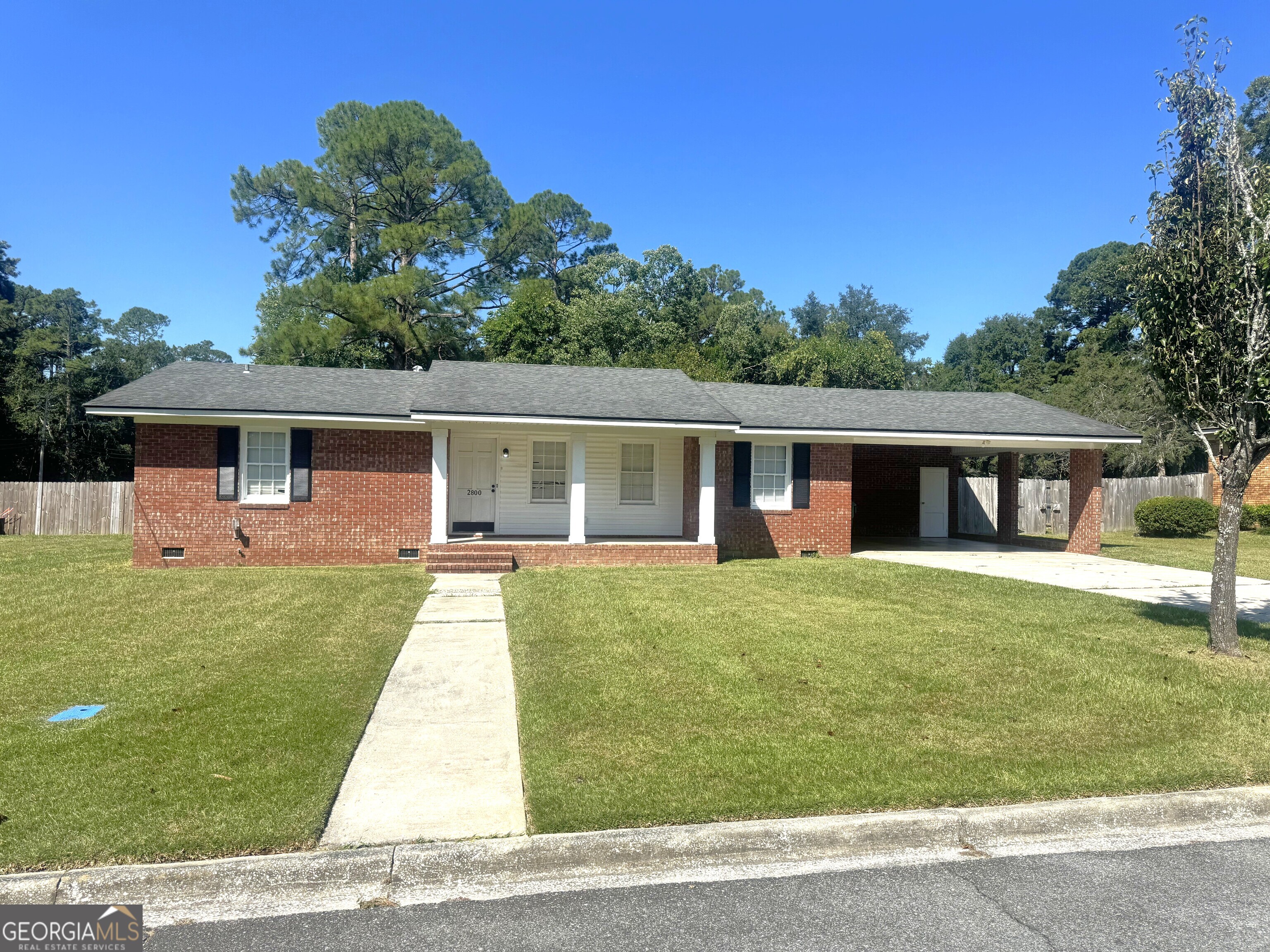 Welcome to this charming brick ranch-style home, built with sturdy construction and timeless appeal in the heart of Valdosta! Step onto the quaint front porch or enjoy gatherings on the back patio overlooking a very LARGE, FENCED BACKYARD-perfect for play, gardening, or relaxation. Inside, you'll find spacious living areas and a large kitchen ideal for everyday living and entertaining. A generous laundry room adds convenience, while the BRAND NEW LVP flooring brings modern style and durability throughout. Nestled in a quiet neighborhood within walking distance of schools and parks, this home offers comfort, functionality, and room to grow. Owners holds Active Real Estate License in the State of Georgia.