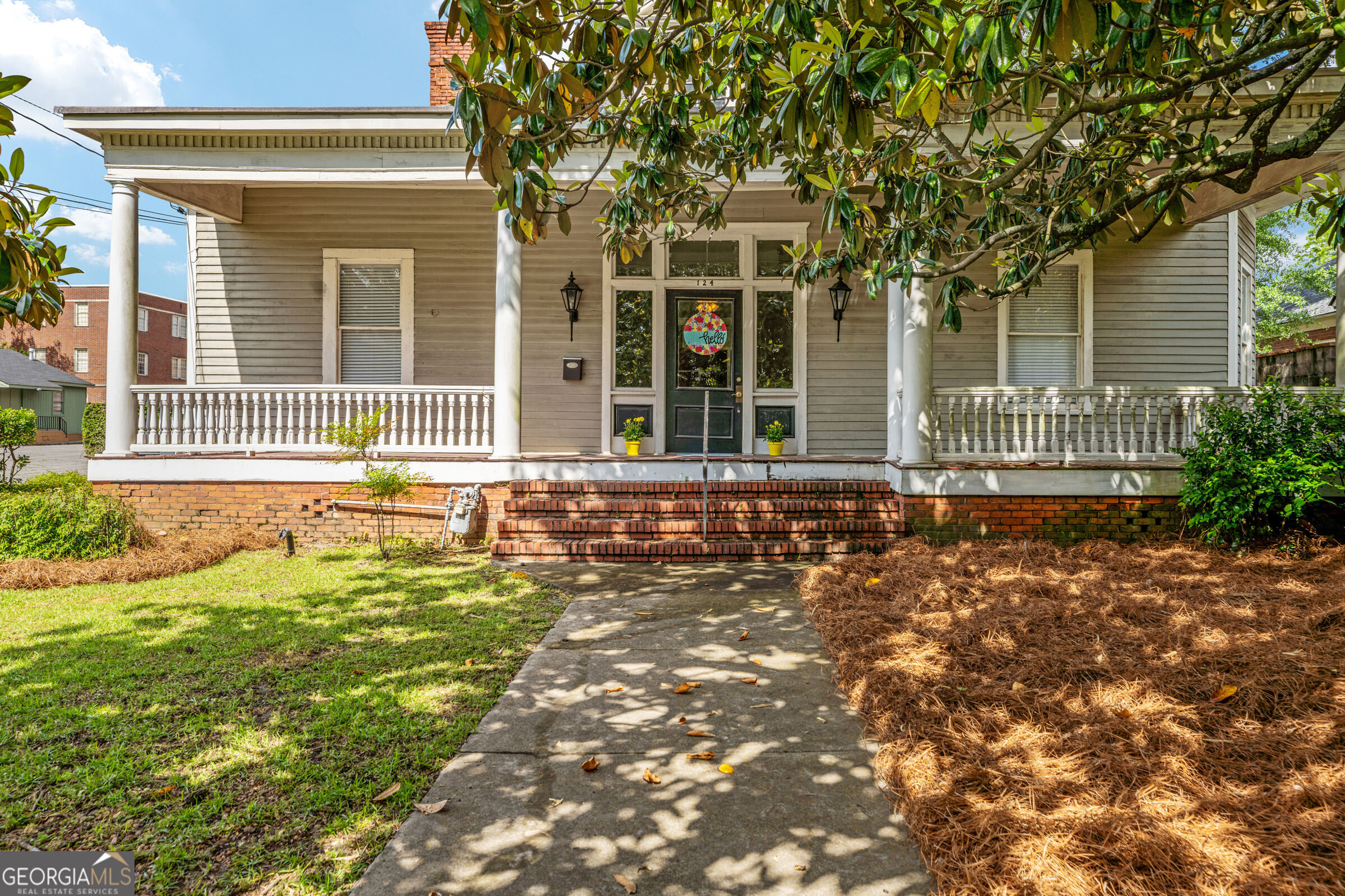 This is your opportunity to not only own an affordable home on the highly desired Hines Terrace but also to bring to life this solid 1910 historic beauty! The deep front porch greets you under the shade of a gorgeous magnolia tree. With a lovely glass entry complimented by antique lantern sconces, home has never felt so inviting! So many possibilities for furniture layout with the large front room with a dining room or flex room attached by original sliding pocket doors. Original details at every turn from the hardwood floors throughout, decorative fireplaces and 12 foot ceilings. The exterior of the home has an open backyard with room for gardening, a playground and/or for pets to run. 124 Hines Terrace has possible driveway entrance and on street parking lined by sidewalks and beautiful historic homes. This home could increase in value quickly with thoughtful upgrades and offers a return on investment. Schedule your private showing today and discover the beautiful Hines Terrace lifestyle.