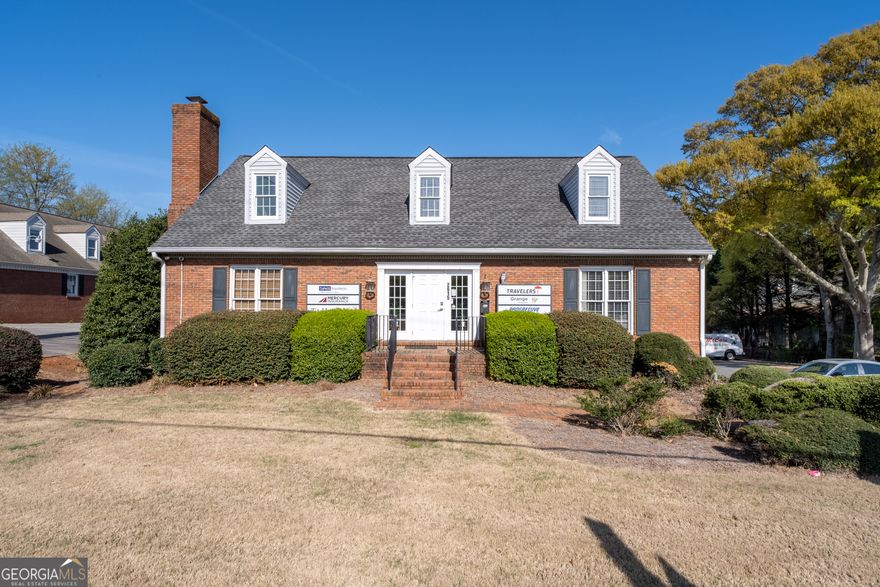 Prime office space available in a highly visible and accessible location at 2615 Sandy Plains Rd, situated at the busy intersection of Sandy Plains Rd and Piedmont Rd in Marietta, GA. This approximately 4,000-square-foot building is ideal for professional office use and offers a well-designed layout across three levels.    The building features **15 private offices**, **two spacious conference rooms**, a **break room**, and **three restrooms** to accommodate staff and visitors. The **basement level includes a separate exterior entrance**, making it perfect for a secondary business operation or private suite.    Positioned in a thriving commercial corridor with convenient access to East Cobb, I-75, and other major thoroughfares, this property offers excellent visibility and signage potential for growing businesses.     Whether you're looking to expand your operations or establish a new office in one of MariettaCOs most desirable areas, this property checks all the boxes.