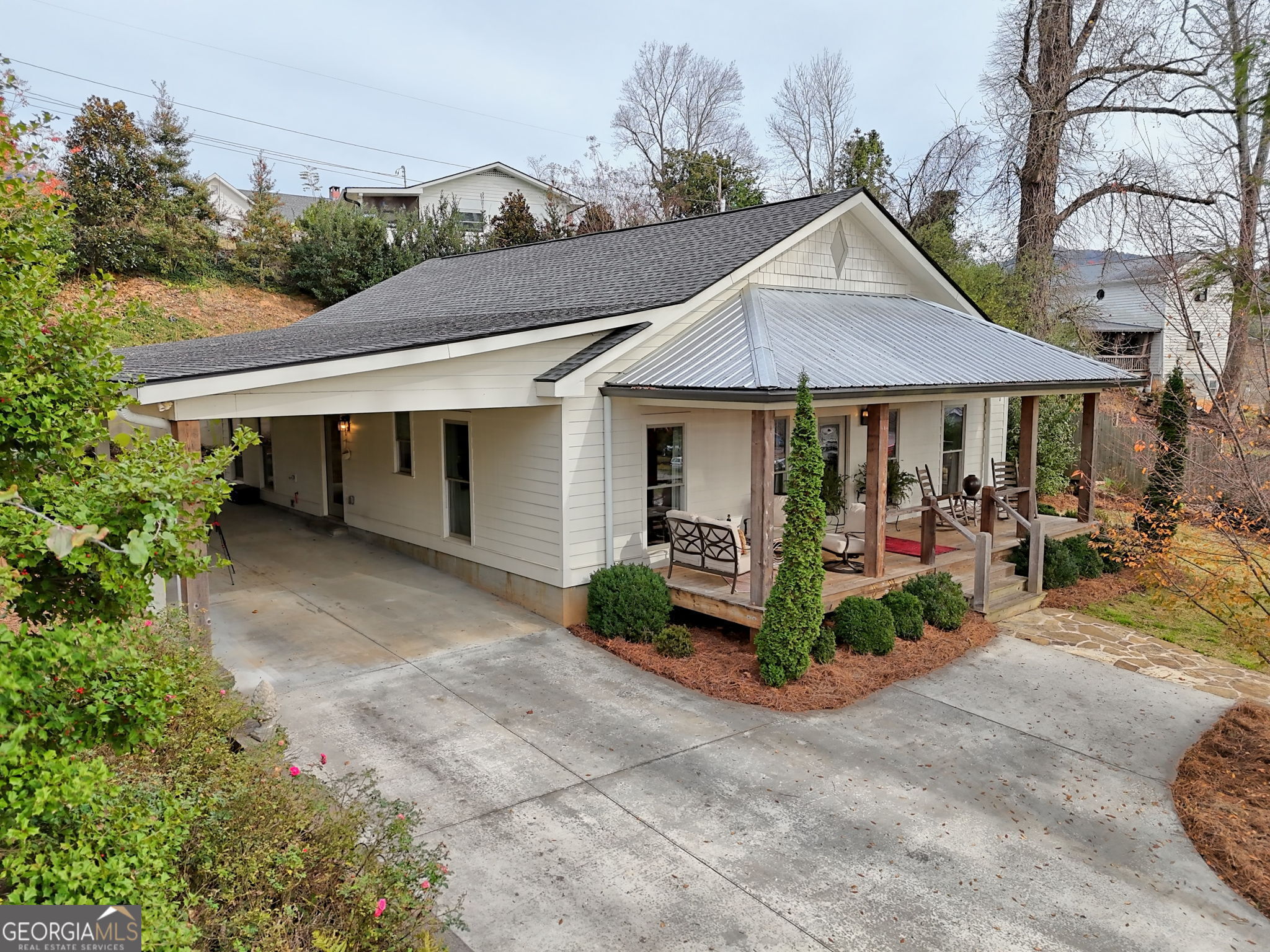 BACK ON MARKET through no fault of seller... Welcome to your dream home in charming Clayton, Georgia! This delightful 3-bedroom, 3-bathroom craftsman home offers the perfect blend of comfort and contemporary living. The custom kitchen features modern amenities that will inspire your inner chef, while the open concept design creates a seamless flow perfect for both everyday living and entertaining. Step outside to discover a private outdoor entertainment area surrounded by attractive landscaping, providing a peaceful retreat for morning coffee or evening gatherings. The property's low-maintenance design means more time enjoying the North Georgia lifestyle and less time on upkeep. The home's thoughtful amenities include a cozy fireplace for those mountain evenings and a generator for peace of mind. The primary bedroom offers a private sanctuary, while two additional bedrooms provide comfortable spaces for family or guests. Located in a vibrant neighborhood, you'll be just minutes from downtown Clayton's attractions, including the renowned Fortify Kitchen and Bar, charming local shops like Wander North Georgia, and convenient amenities such as the post office and Ingles grocery store. Whether you're seeking a permanent residence or a mountain getaway, this property delivers the perfect balance of comfort and convenience. This home isn't just a place to live - it's an invitation to embrace the sought-after North Georgia mountain lifestyle, where small-town charm meets modern comfort. *Short term rentals ARE allowed in city of Clayton!